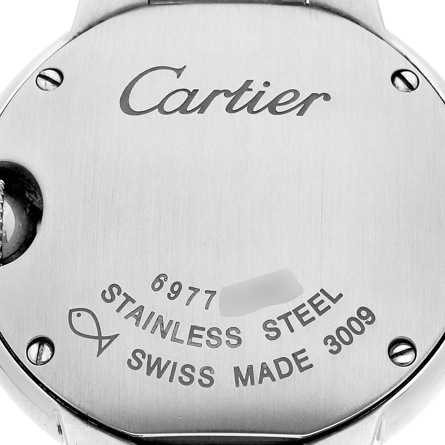 This image shows the back casing of a Ballon Bleu model by Cartier, highlighting "Cartier" engraving and other markings.