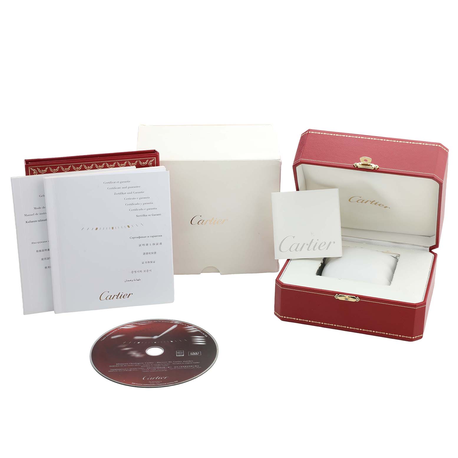 The image shows accessories for the Calibre de Cartier watch, including a red box, manuals, and a CD.