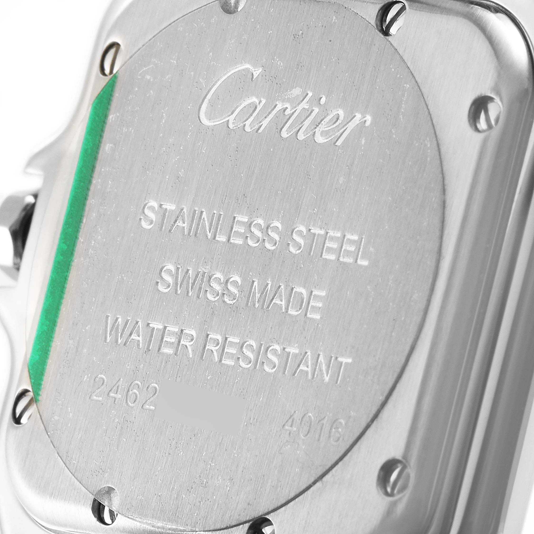The image shows the back of a Cartier Panthère watch, highlighting the engraved details on the stainless steel case.