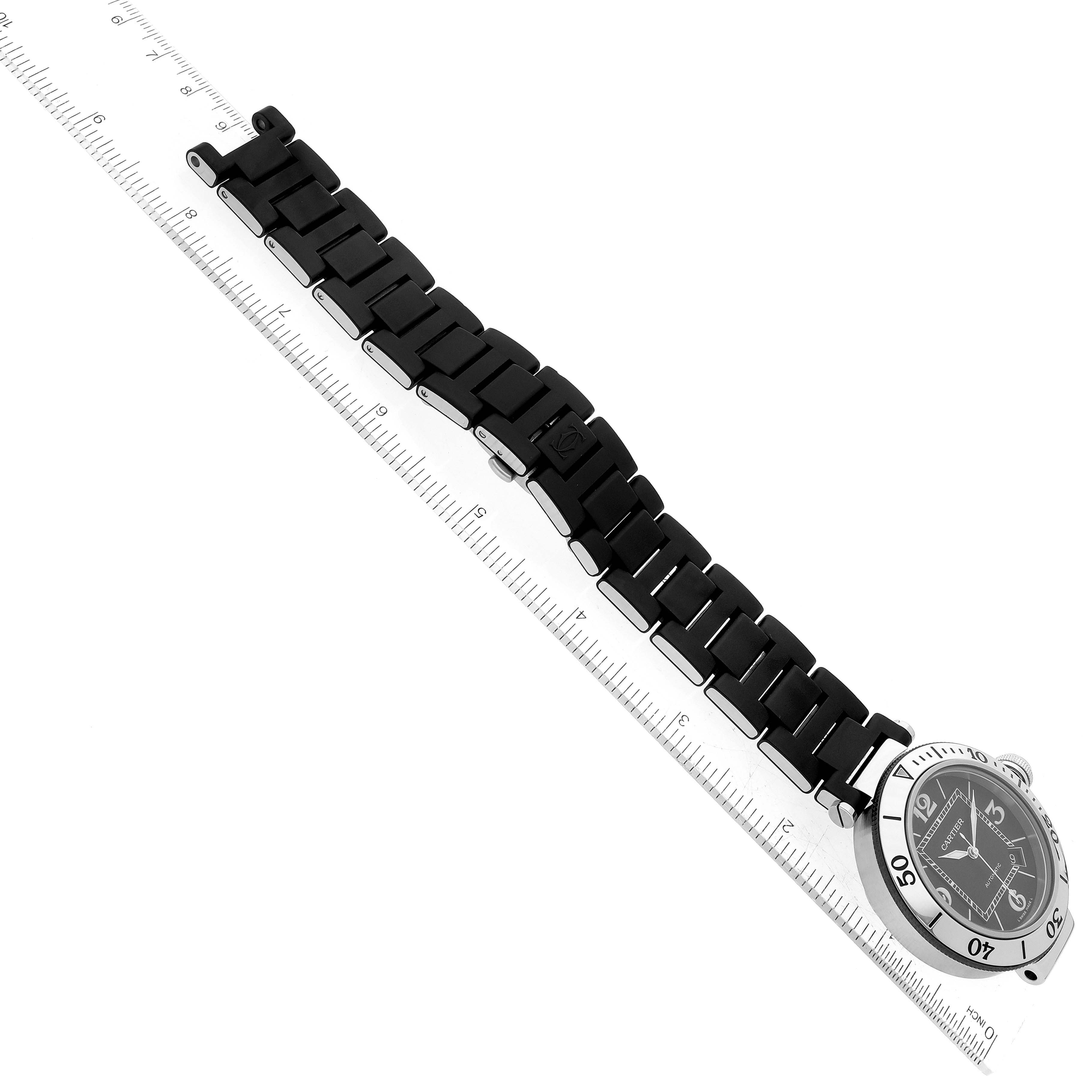 The image shows a Cartier Pasha 63249 Men
s Stainless Steel Black Dial 63249 Men
s Stainless Steel Black Dial model watch from a top-down angle, highlighting the face and black metal bracelet.