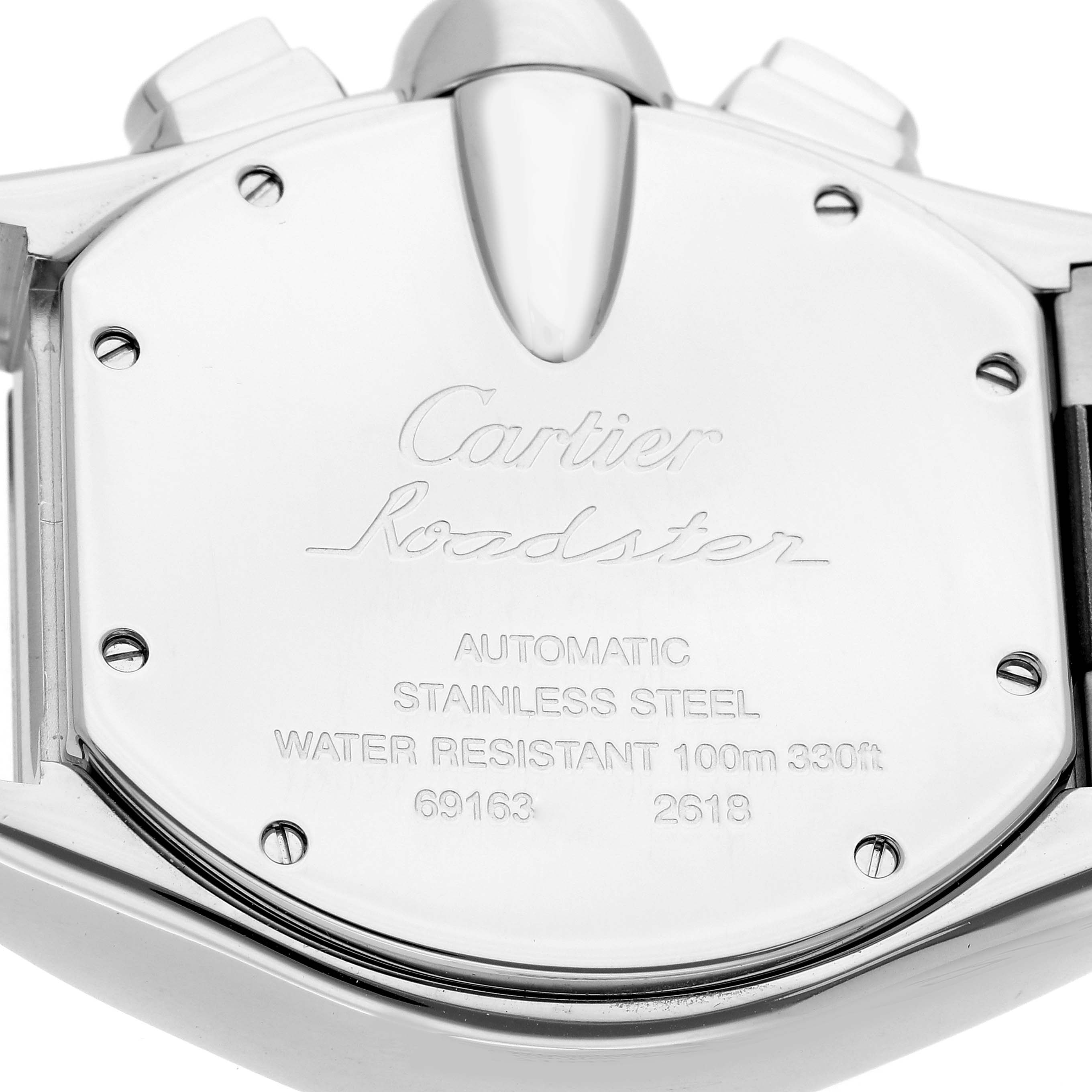 The image shows the back case of the Cartier Roadster men's watch, model number W62020X6, highlighting its engravings and stainless steel material.