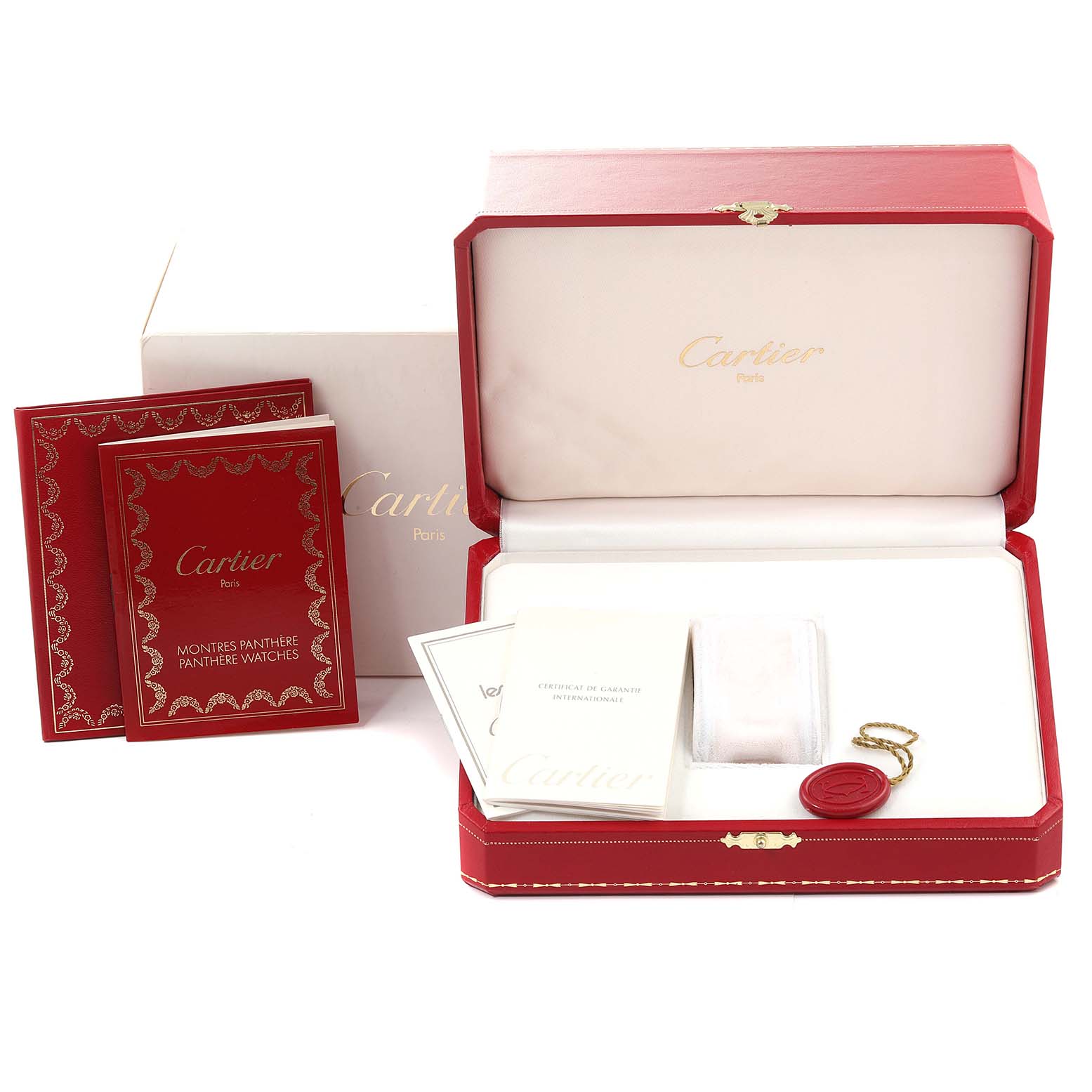 The image shows the packaging, manuals, and accessories for a Cartier Tank Americaine WB7018L1 Women's White Gold Silver Dial WB7018L1 Women's White Gold Silver Dial watch.