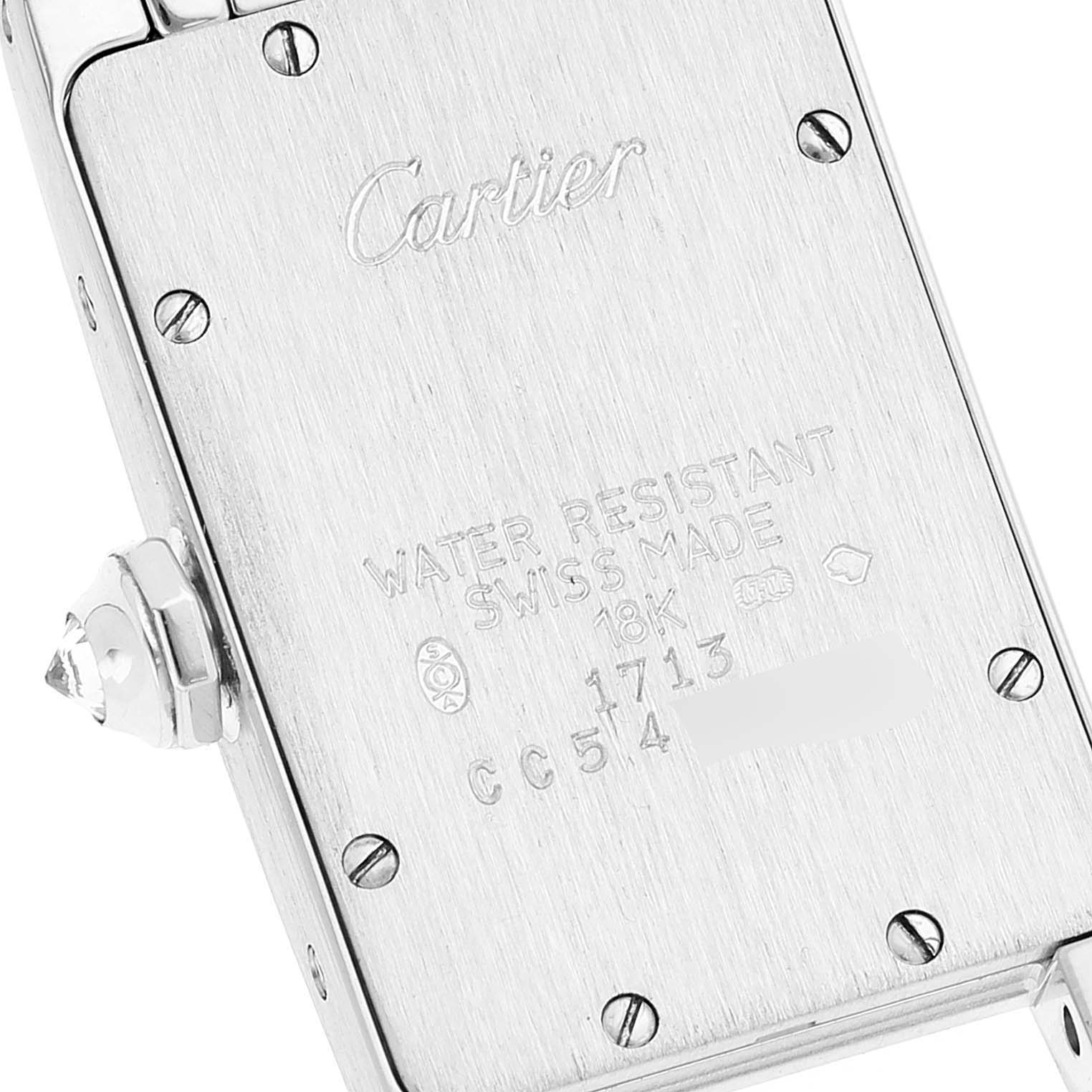 The image shows the back side and crown of the Cartier Tank Americaine WB7018L1 Women's White Gold Silver Dial WB7018L1 Women's White Gold Silver Dial watch, highlighting its engravings and water resistance.