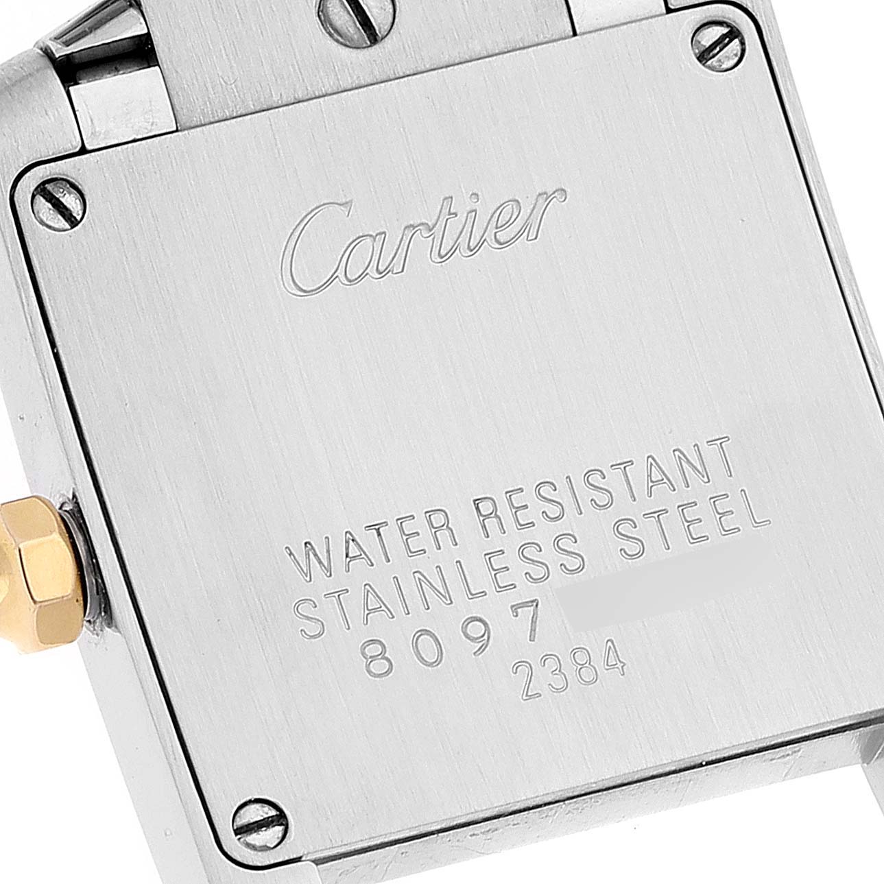 The image shows the back case of a Cartier Tank Française watch with engravings indicating it is water resistant and made of stainless steel.