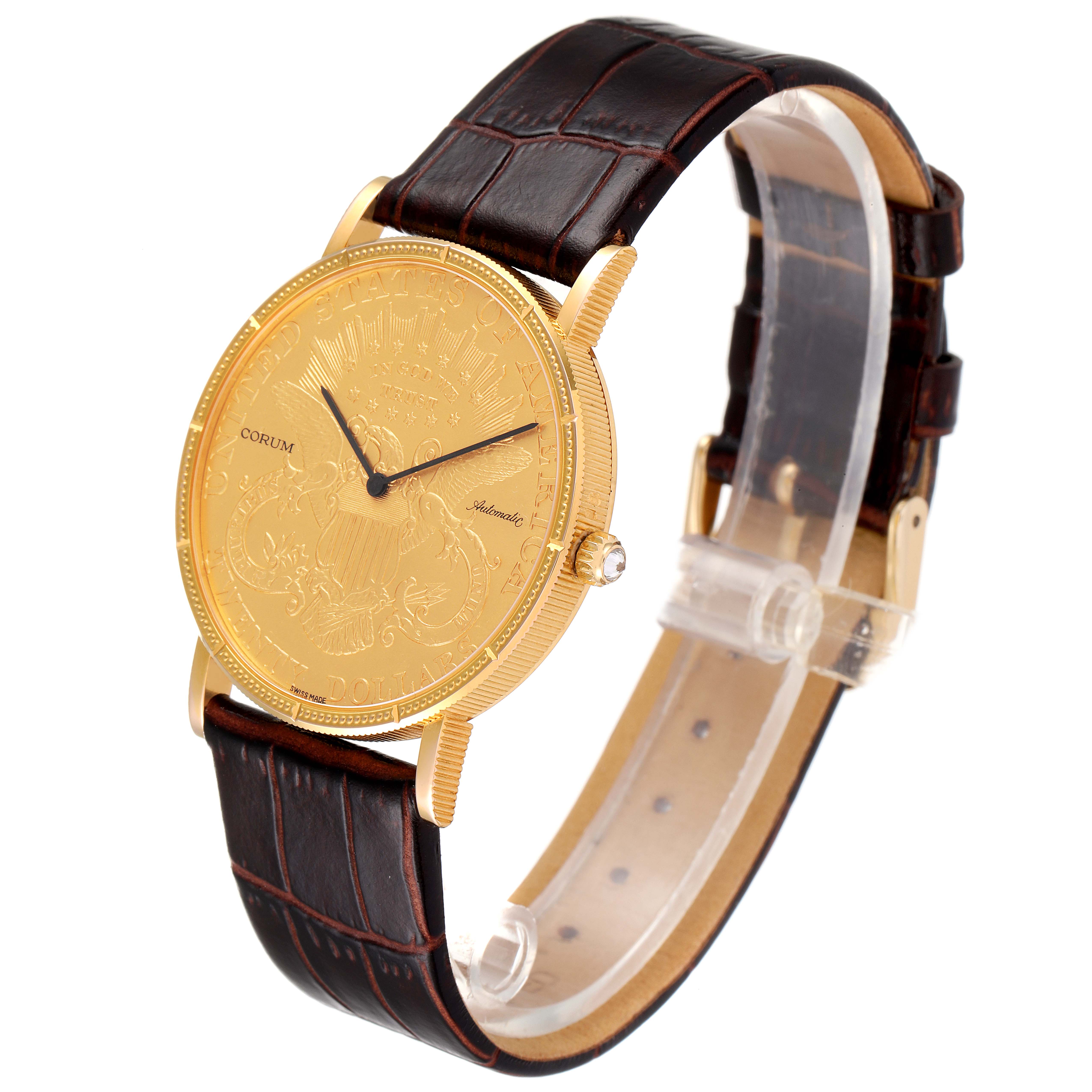 The photo shows a Corum Coin Watch 1900 Men's Yellow Gold Black Dial 1900 Men's Yellow Gold Black Dial model at a three-quarter angle, highlighting the gold coin dial, crown, and leather strap.