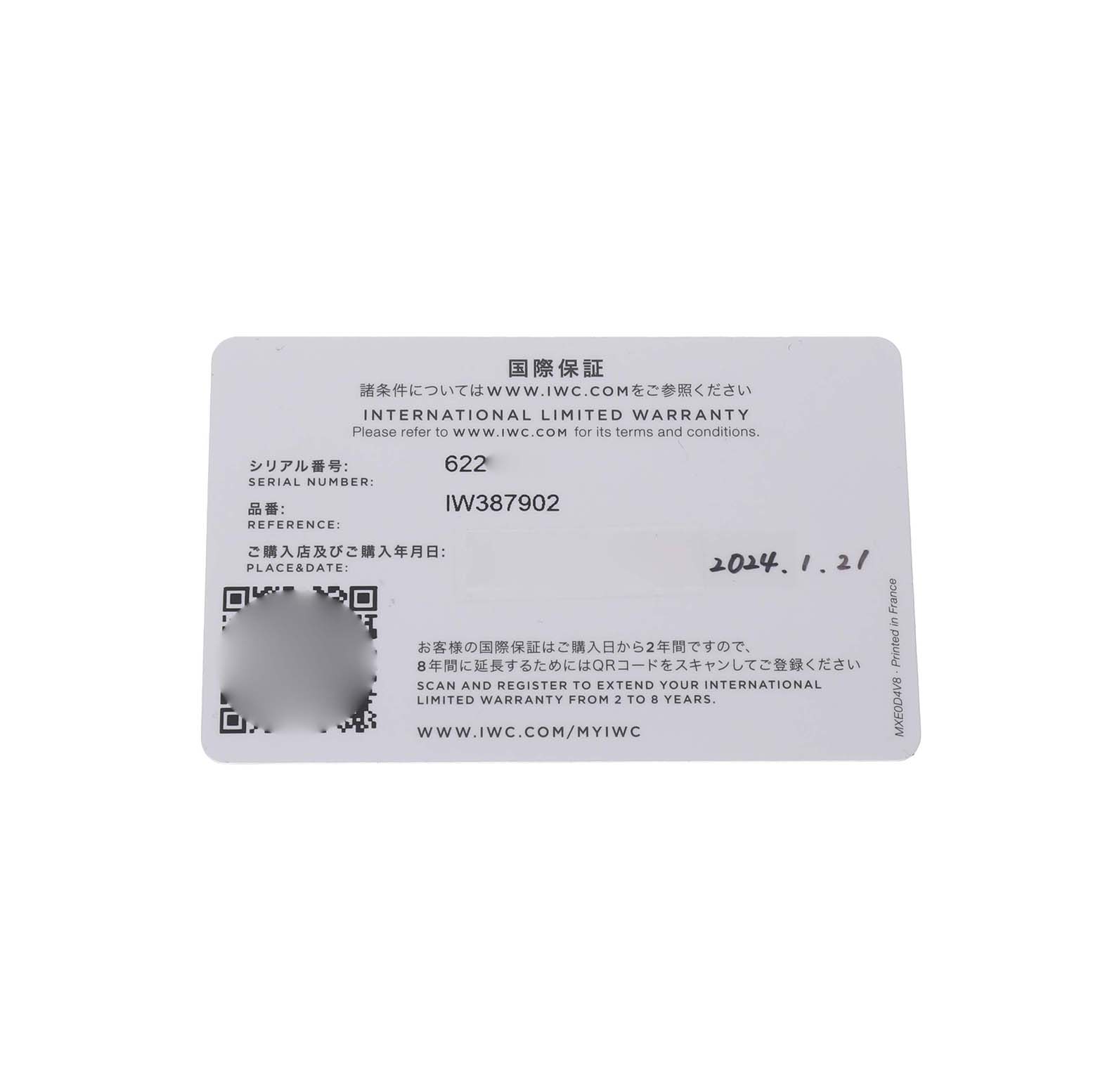 The image shows the IWC Pilot IW387902 Men's Bronze Green Dial model's international limited warranty card, displaying serial and reference numbers.