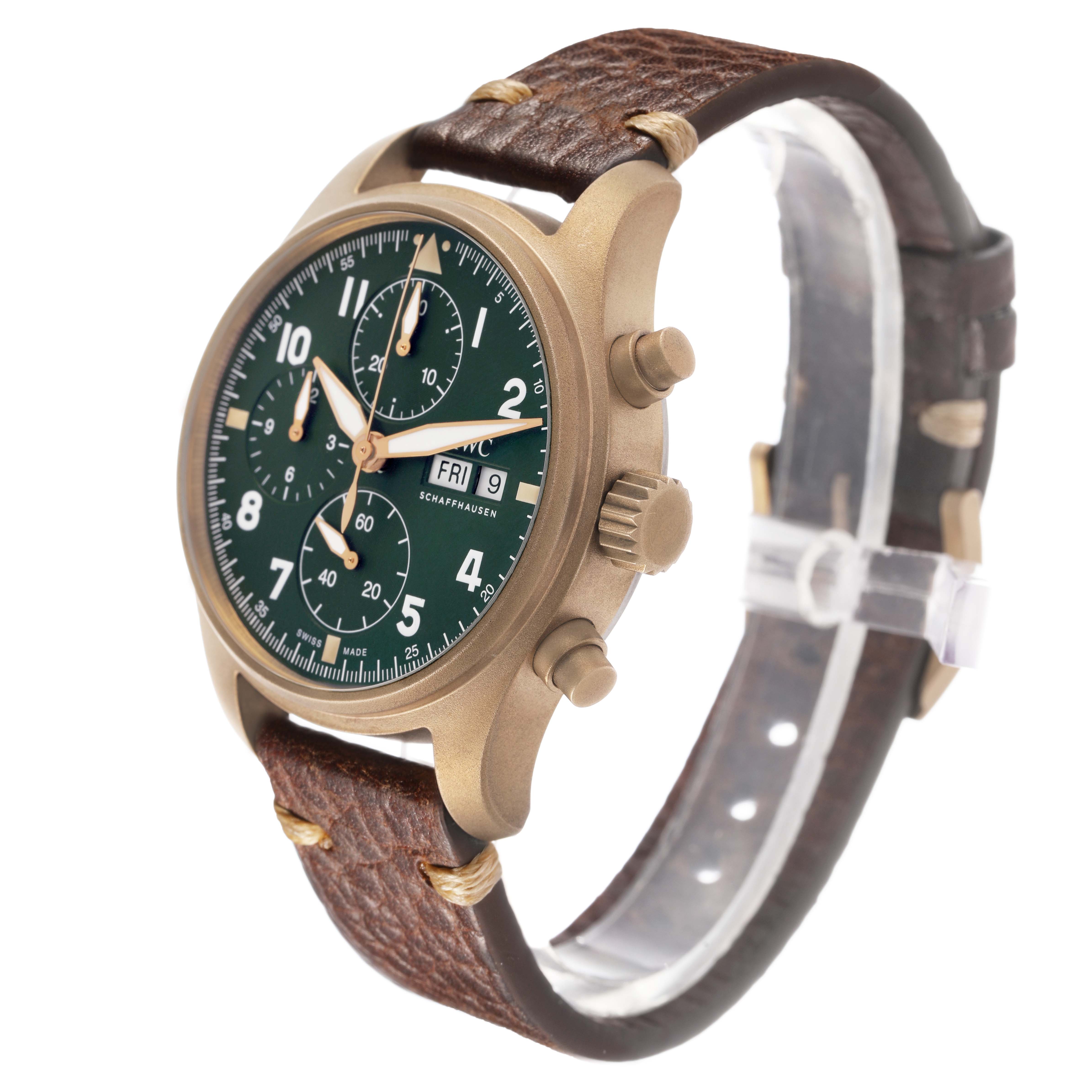 The IWC Pilot IW387902 Men's Bronze Green Dial model is shown at a three-quarter angle, displaying the case, dial, crown, pushers, and leather strap.
