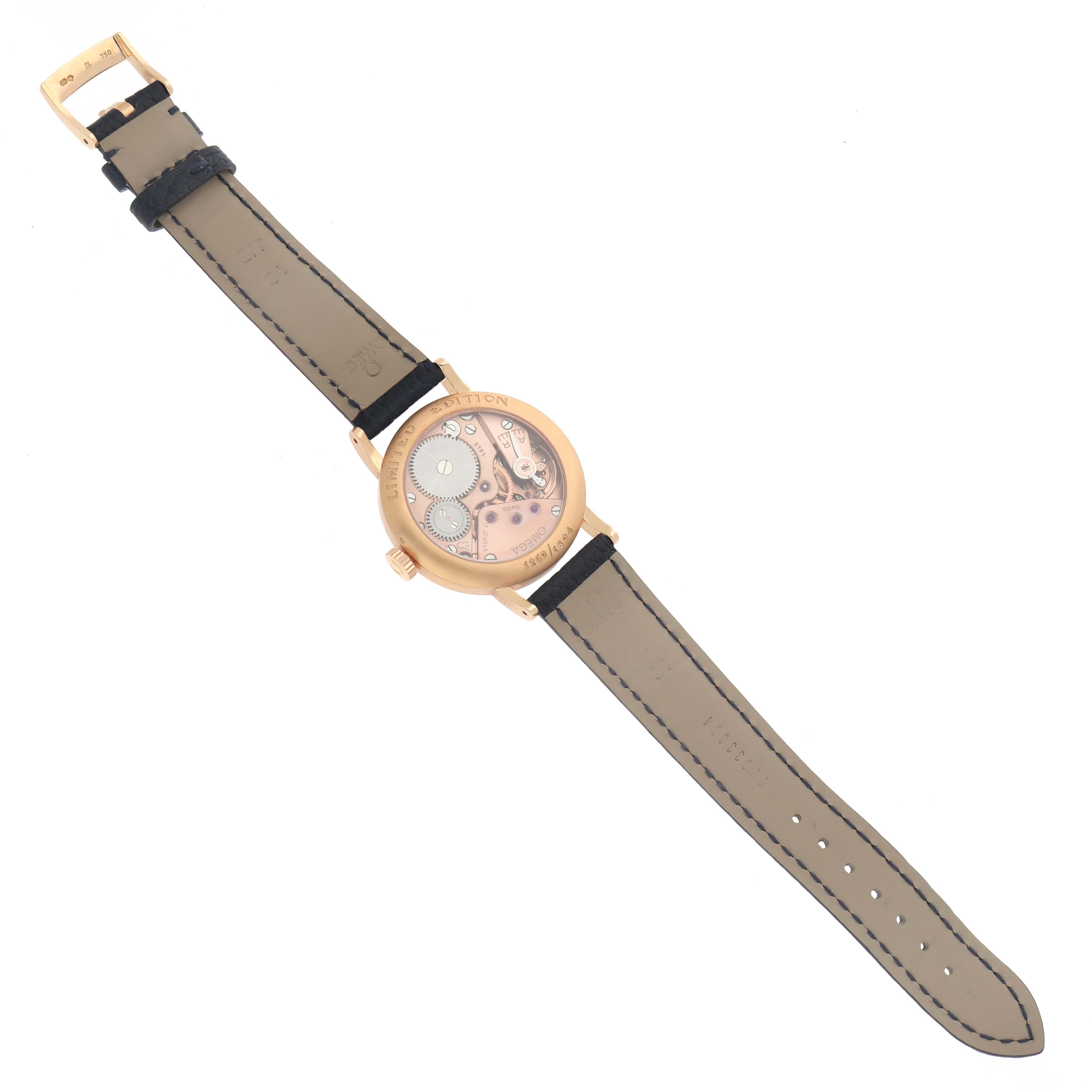 The Omega Museum model 5950.31.03 is shown from a top-down angle, highlighting the reverse side with visible mechanism through the transparent case back.