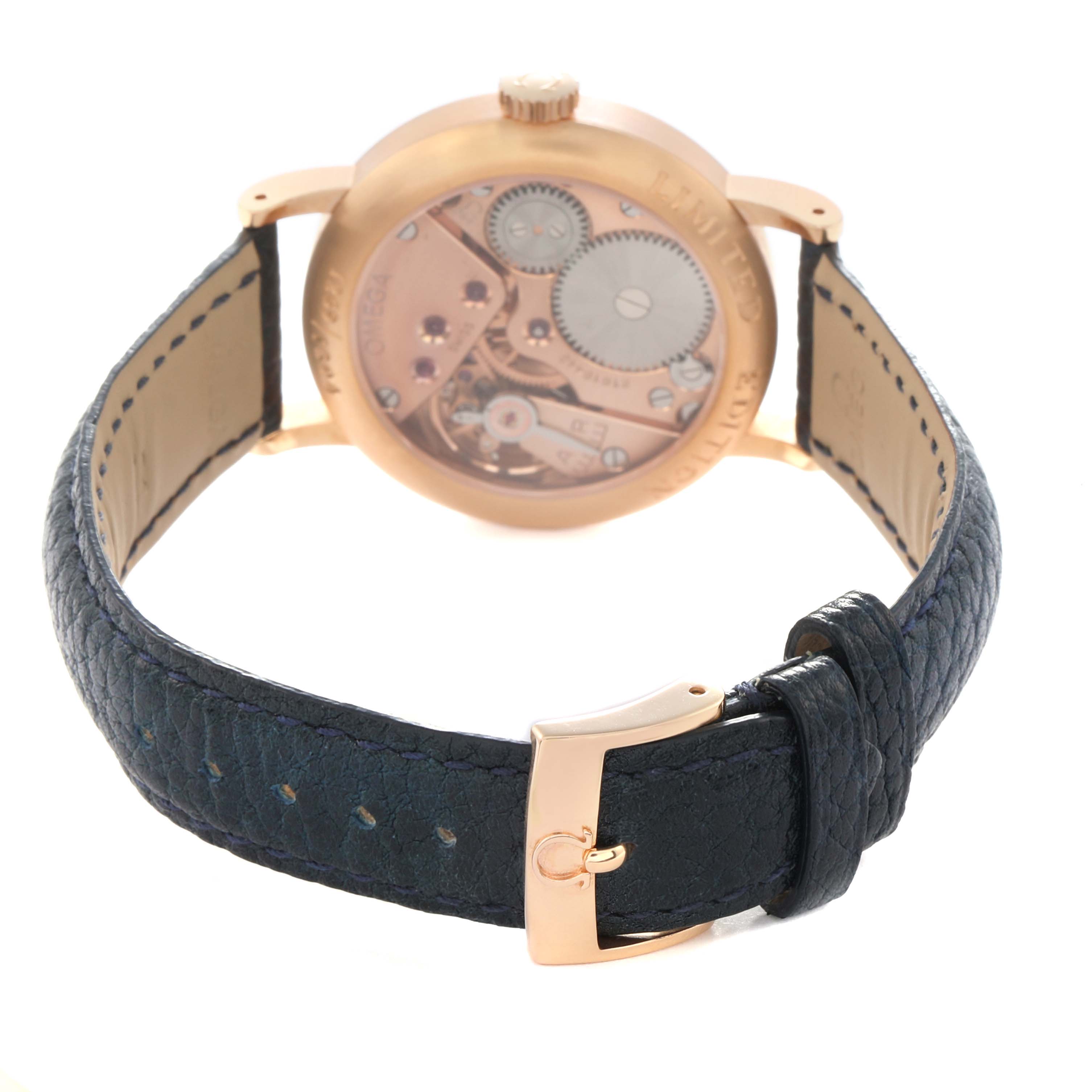 The image shows the back view of an Omega Museum model watch 5950.31.03, highlighting its movement and part of the strap with a buckle.