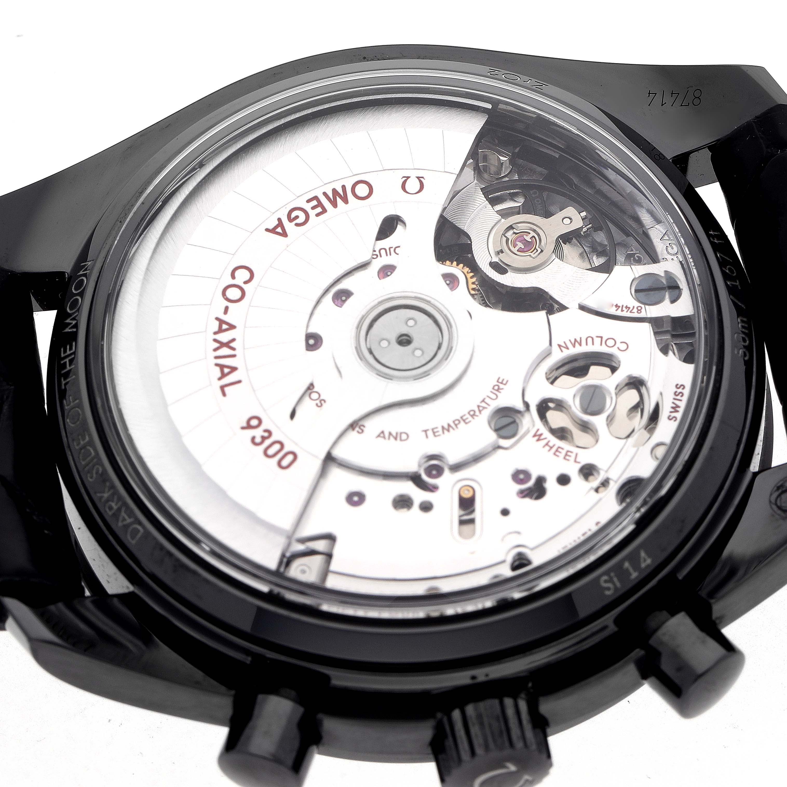 The image shows the case back of an Omega Speedmaster 311.92.44.51.01.003 Men's Ceramic Black Dial, revealing its Co-Axial 9300 movement.