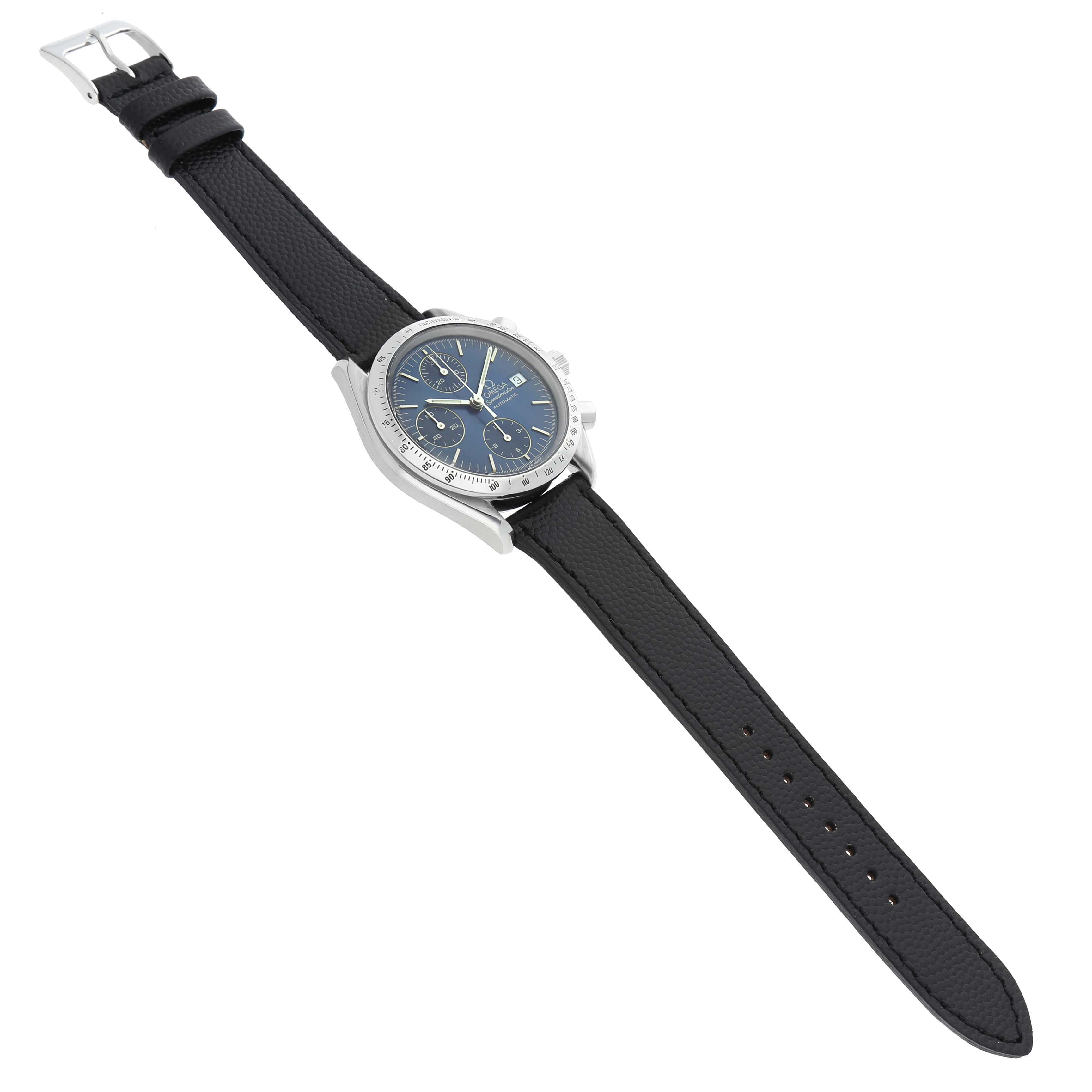 The Omega Speedmaster 3513.30.00 Men's Stainless Steel Blue Dial watch is shown at a slight angle, featuring its face, bezel, crown, leather strap, and buckle.