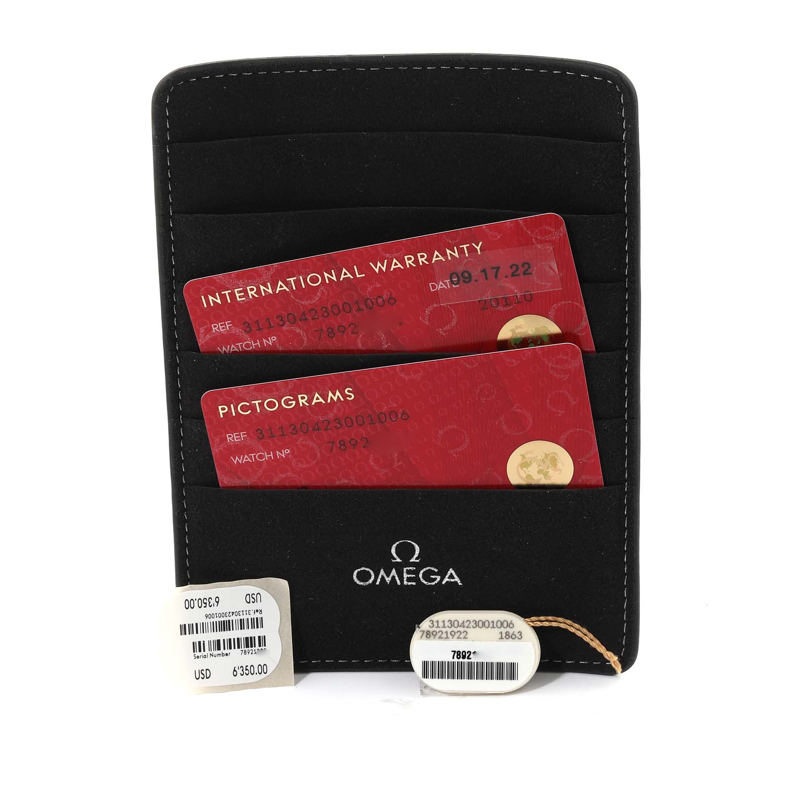 The image shows the Omega Speedmaster 311.30.42.30.01.006 Men
s Stainless Steel Black Dial 311.30.42.30.01.006 Men
s Stainless Steel Black Dial
s international warranty and pictogram cards in a black Omega case, with price tags below.