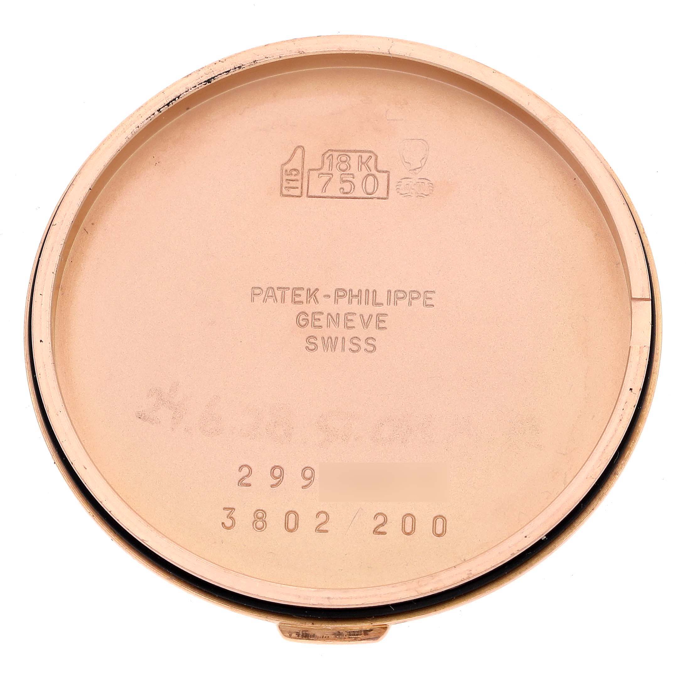 This image shows the inside of the case back of a Patek Philippe Calatrava 3802/200 Men's Rose Gold White Dial 3802/200 Men's Rose Gold White Dial watch, prominently displaying the brand’s engravings.