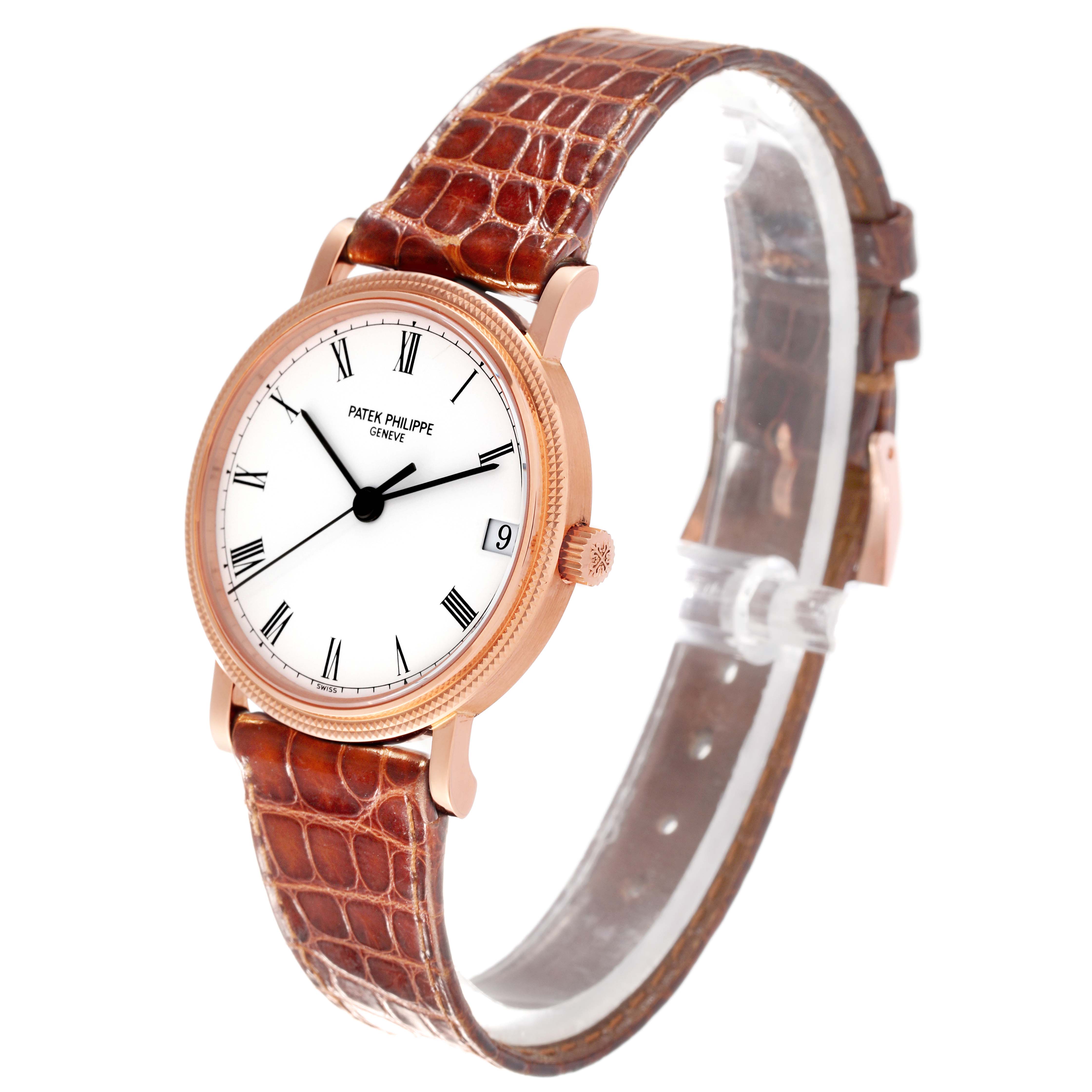 The image shows a side angle of the Patek Philippe Calatrava 3802/200 Men's Rose Gold White Dial 3802/200 Men's Rose Gold White Dial watch, showcasing its face, bezel, crown, and leather strap.