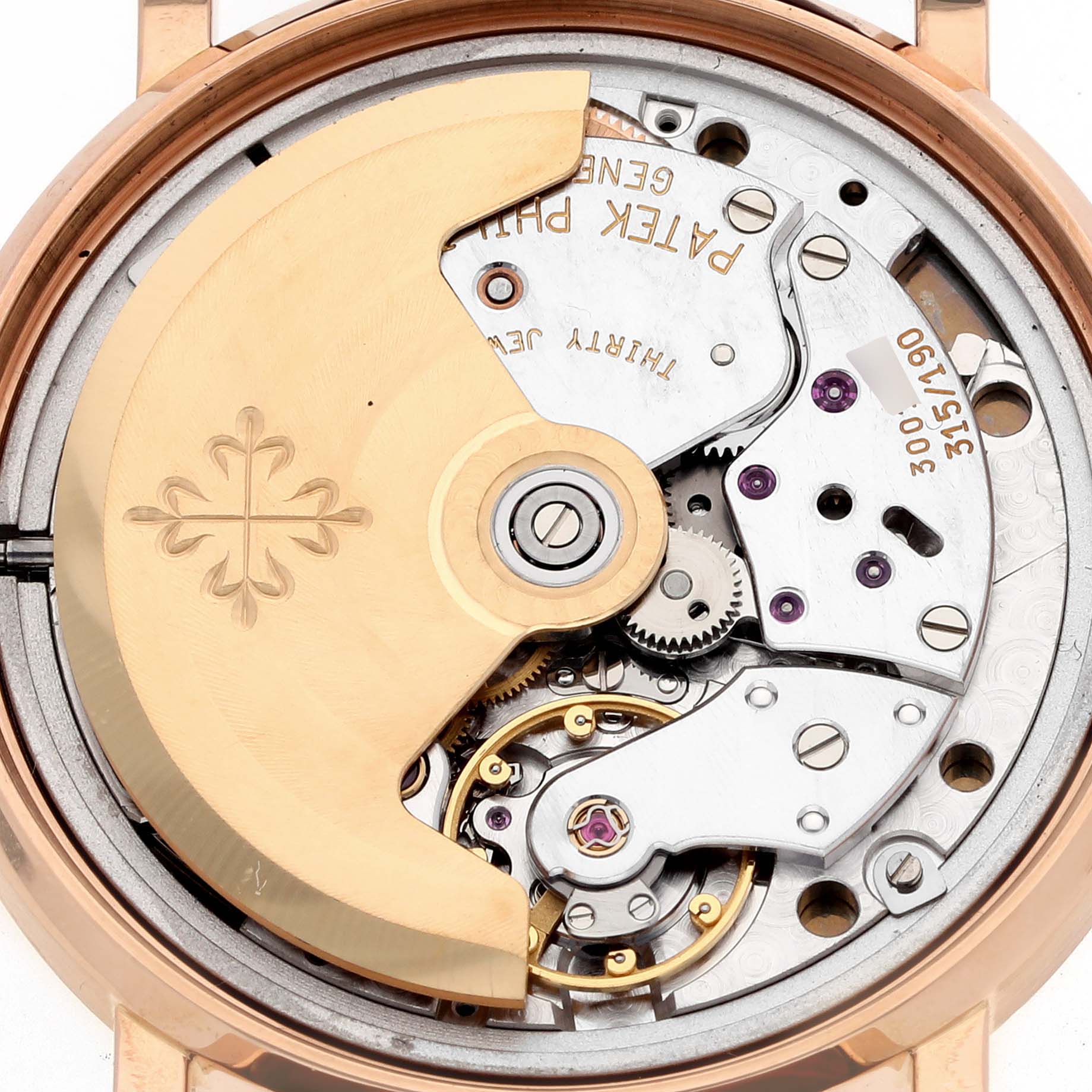 The image shows the movement and inner workings of a Patek Philippe Calatrava 3802/200 Men's Rose Gold White Dial 3802/200 Men's Rose Gold White Dial model watch from a rear angle.