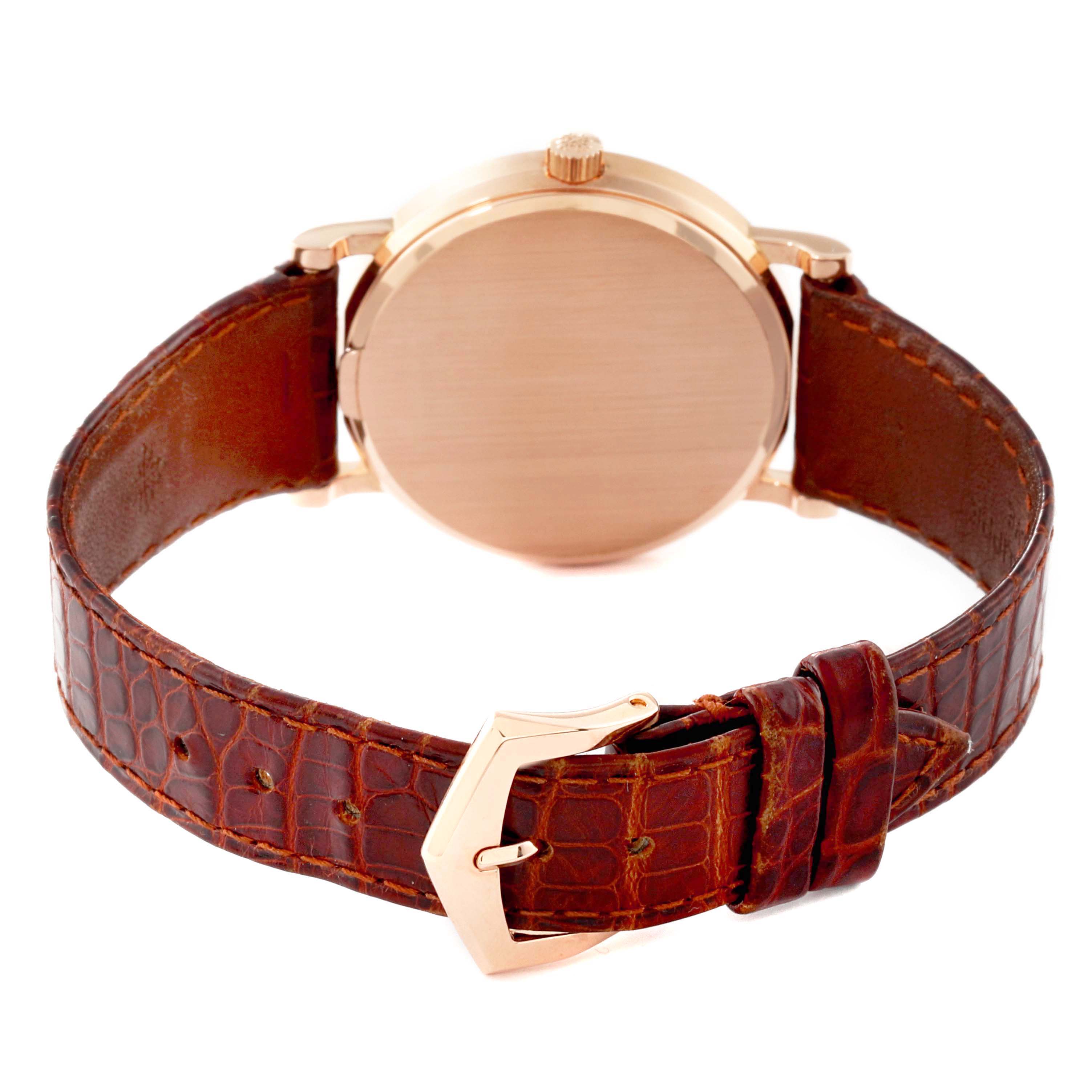 This image shows the back view of a Patek Philippe Calatrava 3802/200 Men's Rose Gold White Dial 3802/200 Men's Rose Gold White Dial watch with a brown leather strap and gold buckle.