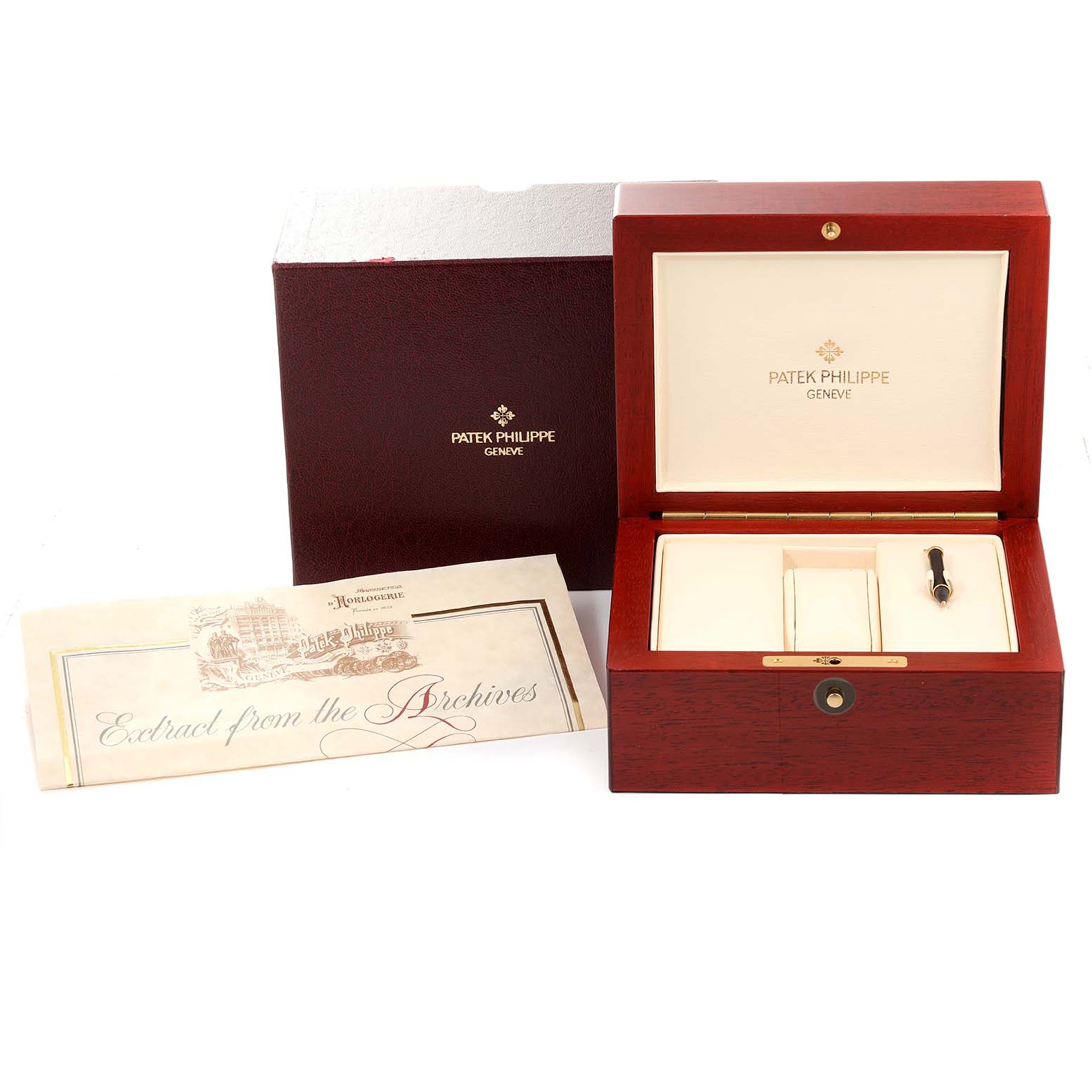 This image shows the open wooden box, an unopened envelope, and a manual for the Patek Philippe Complications 5035G Men's Yellow Gold Silver Dial 5035G Men's Yellow Gold Silver Dial watch.