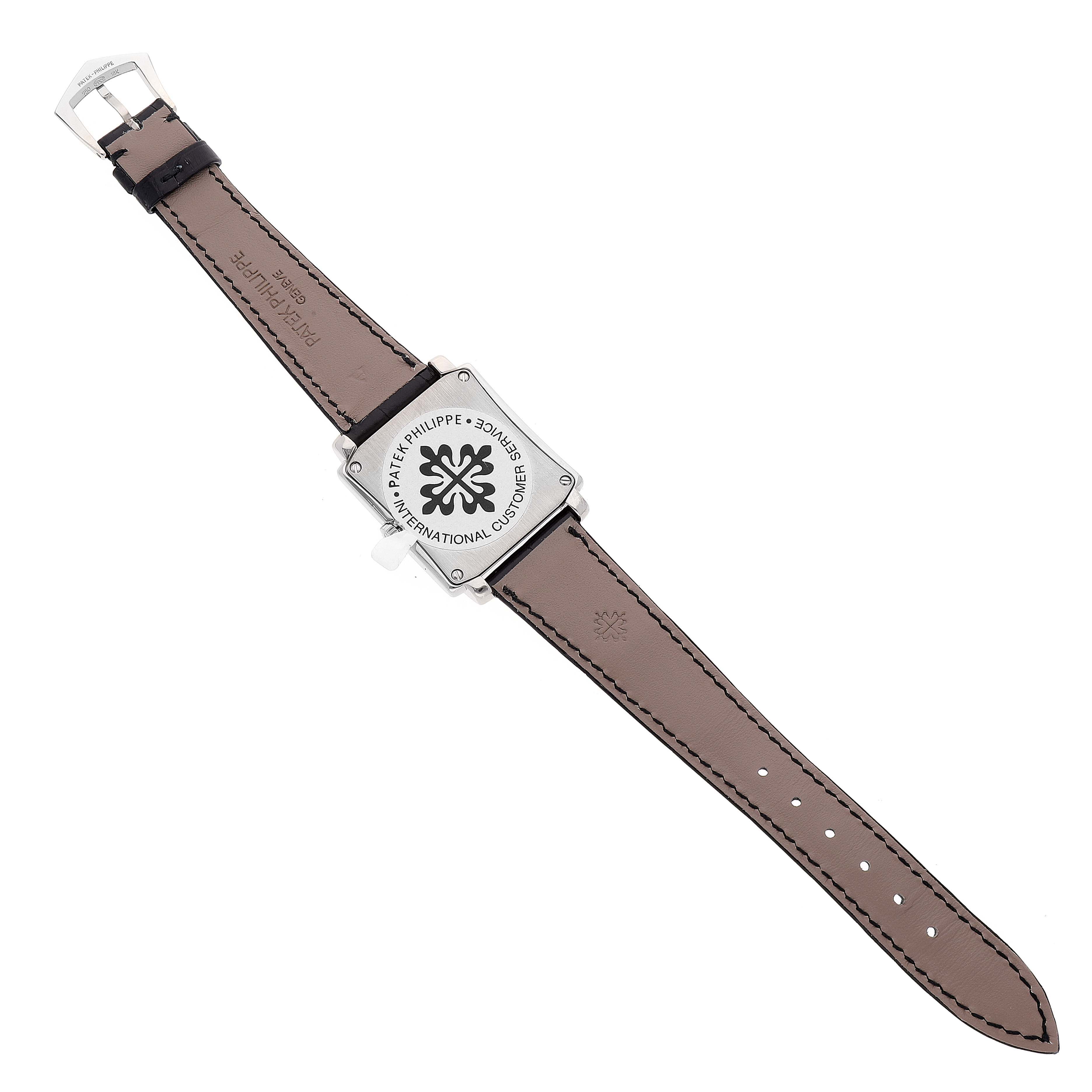 The image shows the back side of a Patek Philippe Gondolo 5024G Men's White Gold White Dial 5024G Men's White Gold White Dial watch, including its brown leather strap and buckle.