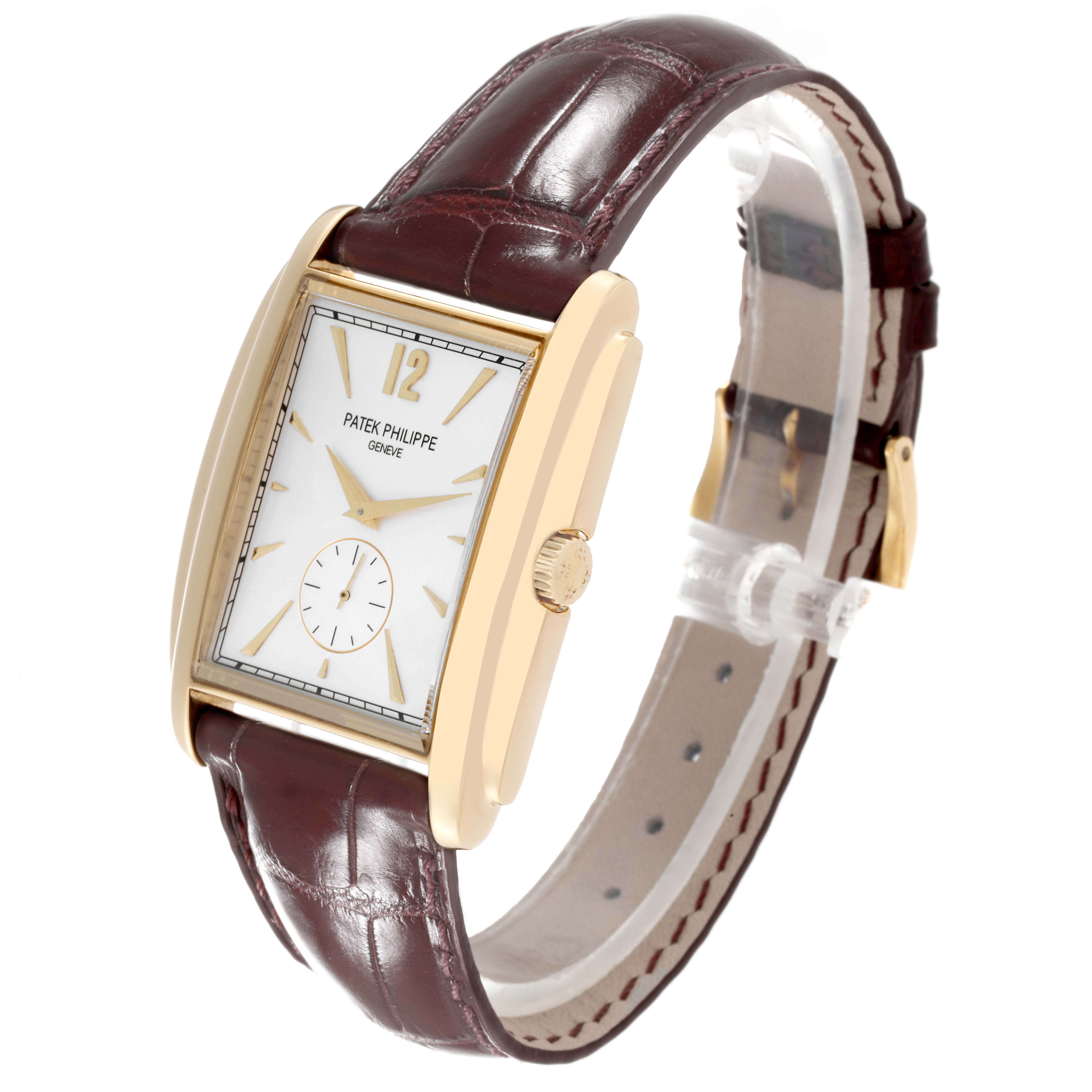 The image shows a side and top view of the Patek Philippe Gondolo 5124J Men's Yellow Gold Silver Dial 5124J Men's Yellow Gold Silver Dial watch, highlighting the rectangular case, crown, and leather strap.