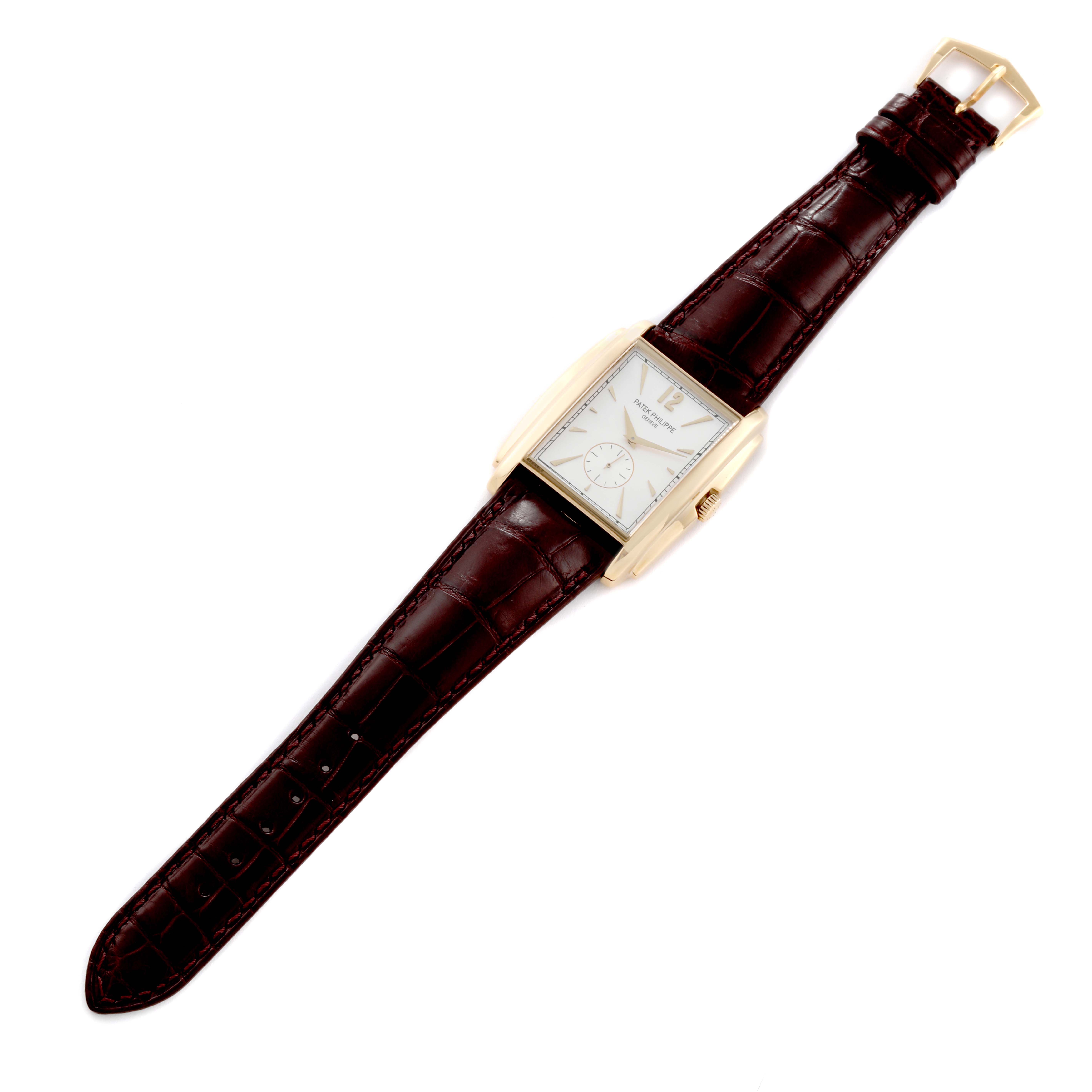 The image shows a top-down view of the Patek Philippe Gondolo 5124J Men's Yellow Gold Silver Dial 5124J Men's Yellow Gold Silver Dial watch, featuring a rectangular dial and brown leather strap.