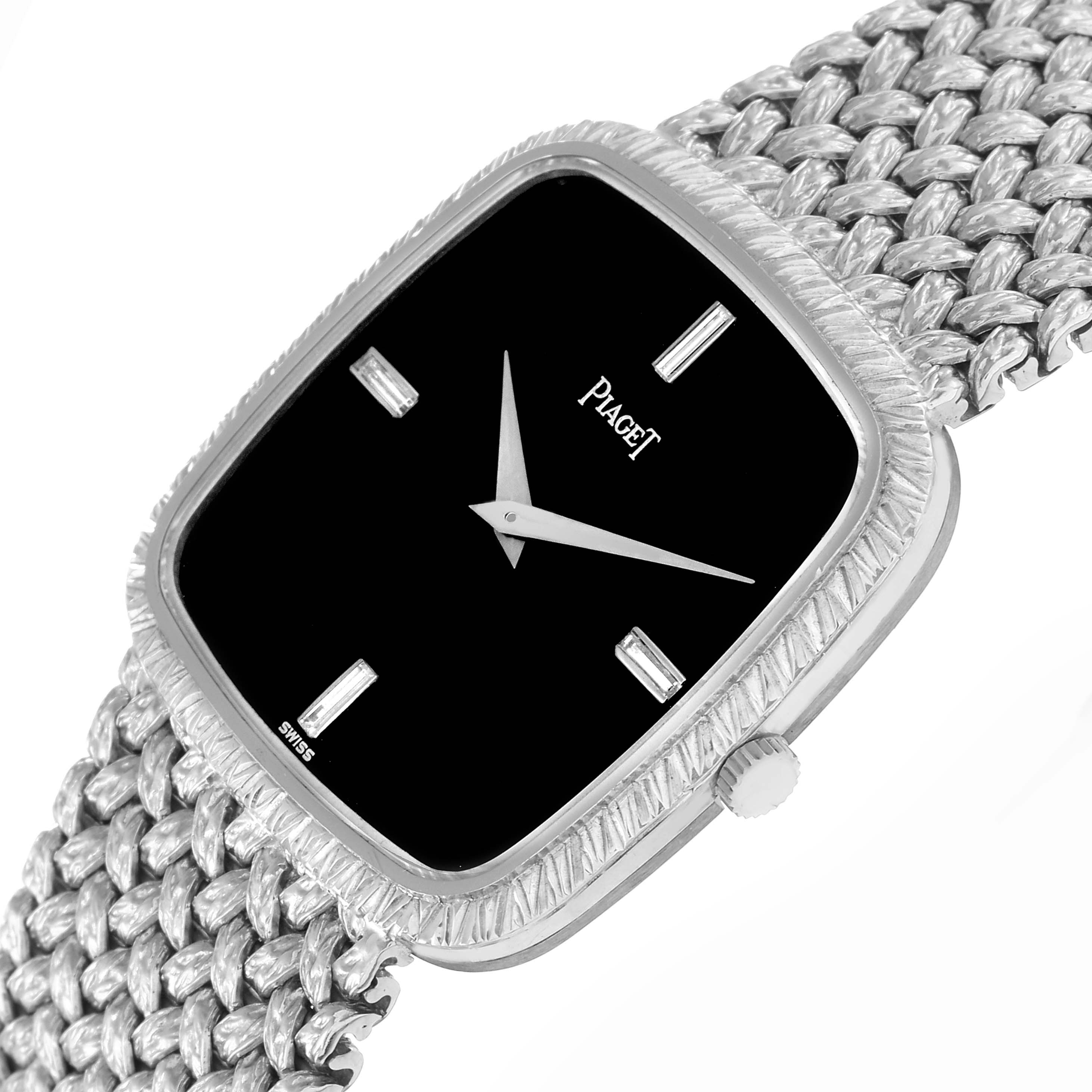 The Piaget model 9771D2 men
s watch is shown at an angled close-up, displaying the rectangular face, textured bezel, crown, and woven bracelet.