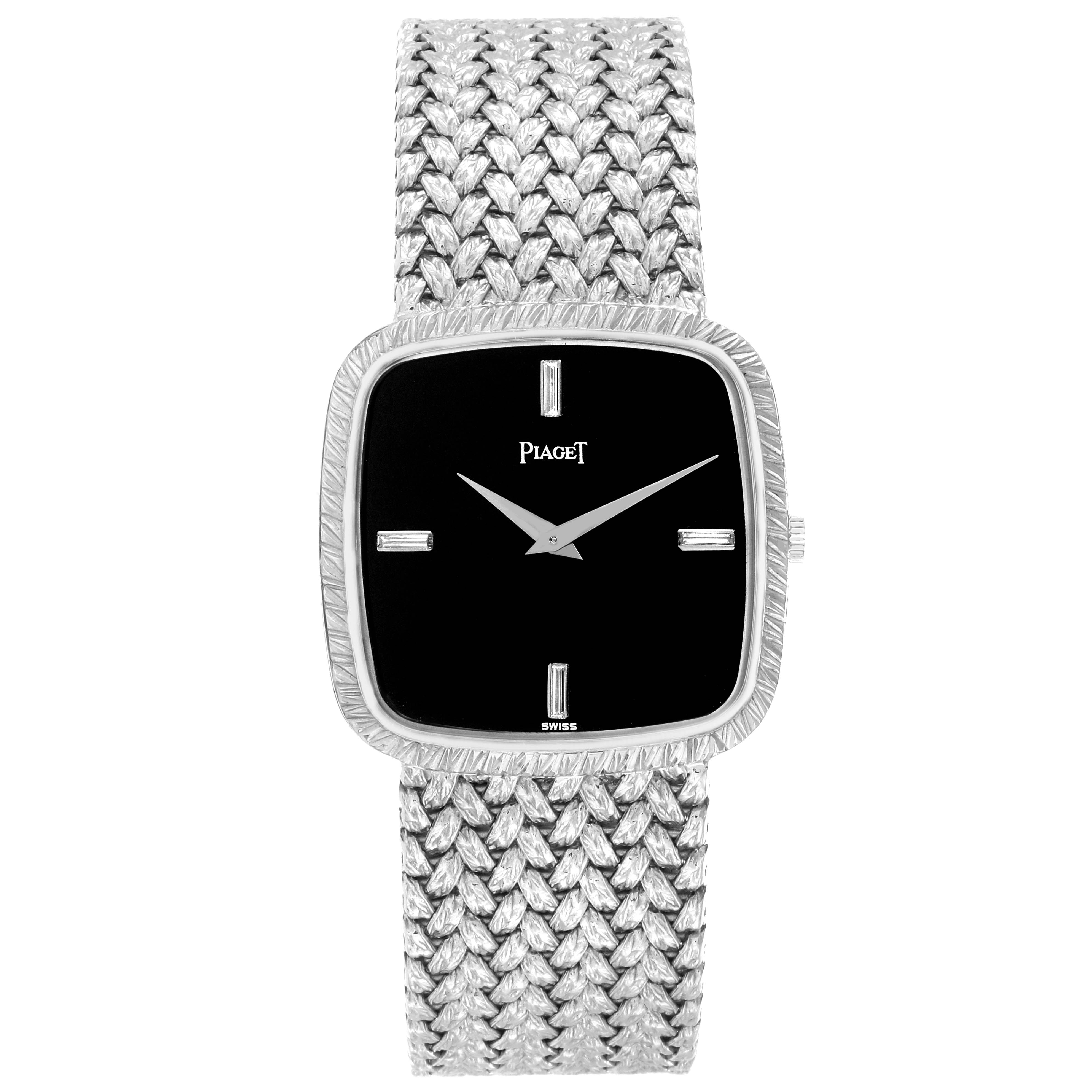 The image shows a frontal view of the Piaget Men
s watch model 9771D2, highlighting its square face, intricate band, and minimalist dial design.