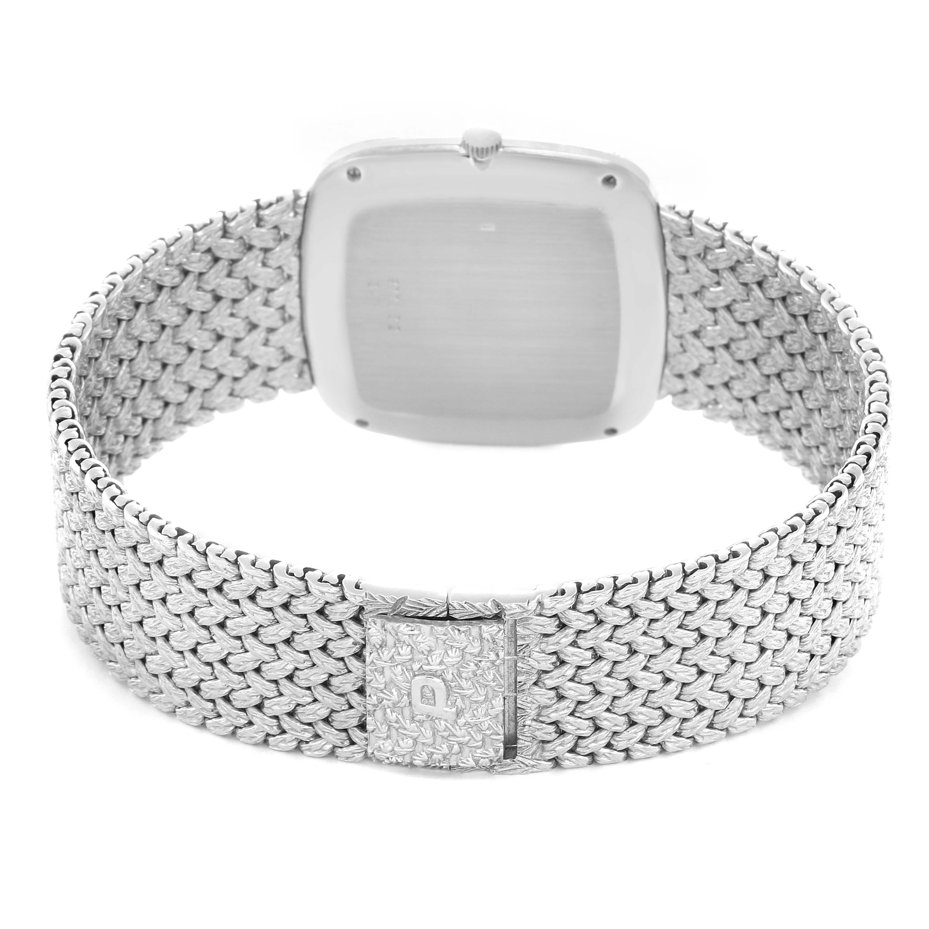 The image shows the back of the Piaget Men
s watch model 9771D2, highlighting the clasp and textured bracelet from a rear angle.