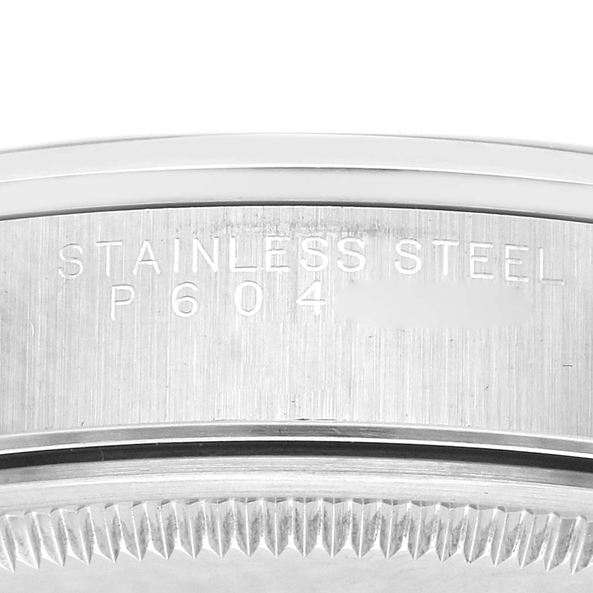 The image shows a close-up of the side and edge of a Rolex Air-King model 14000, featuring stainless steel markings.