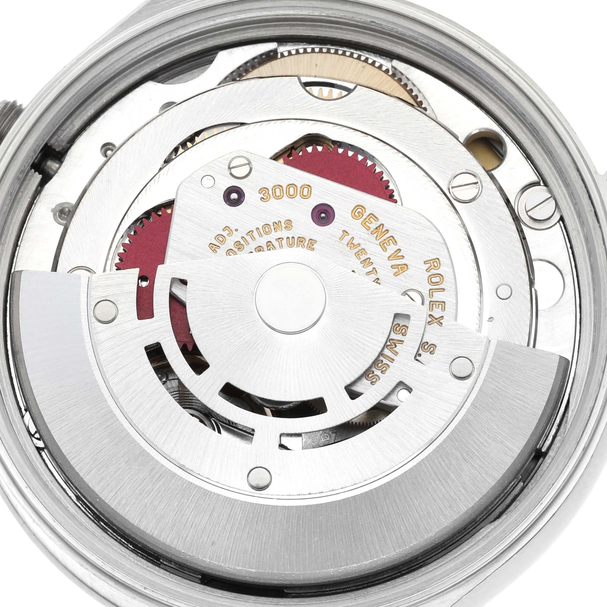 The image shows the internal movement mechanism of the Rolex Air-King model 14000, highlighting gears and the rotor from a top-down angle.