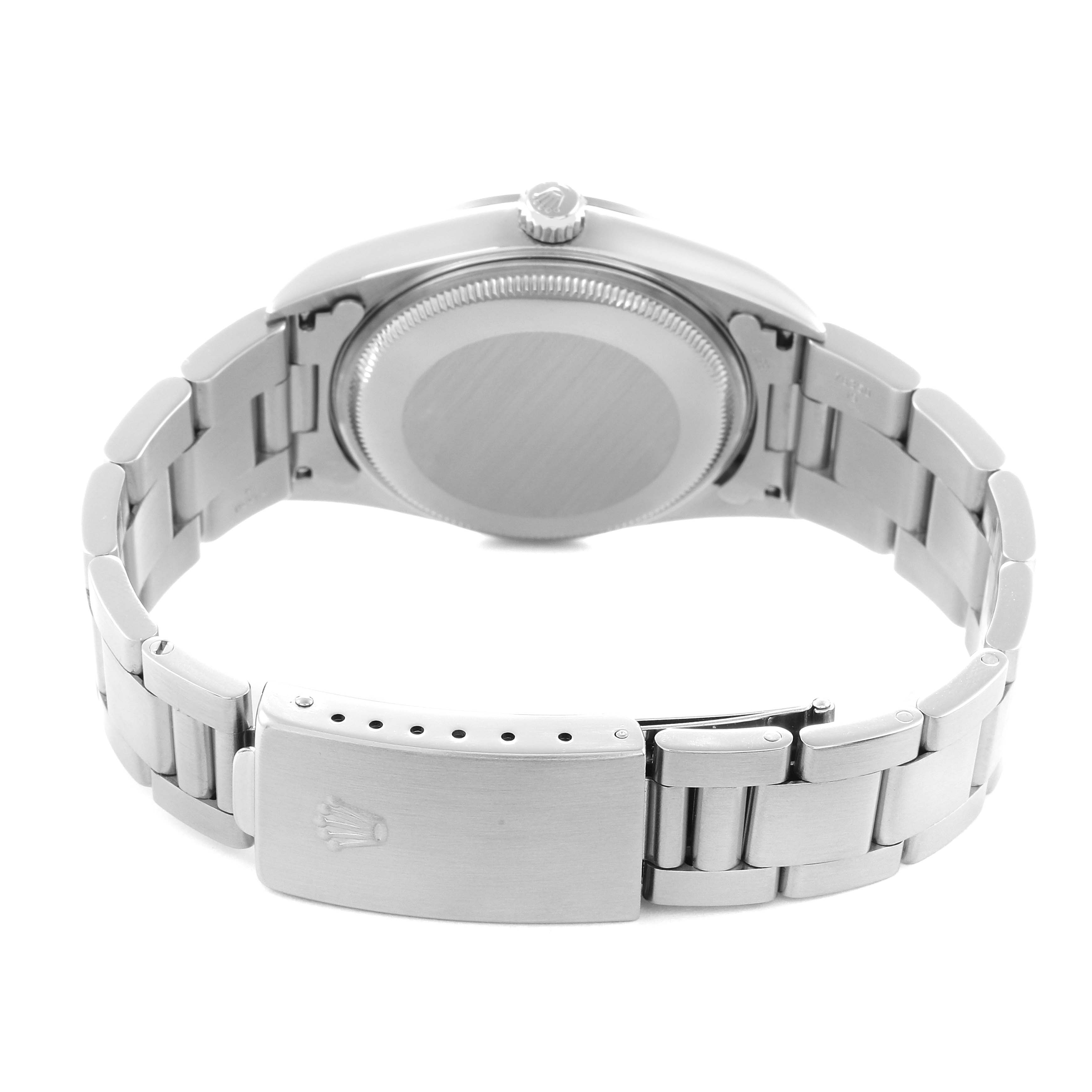 The image shows the back view of the Rolex Air-King model 14000, highlighting the case back and bracelet clasp.