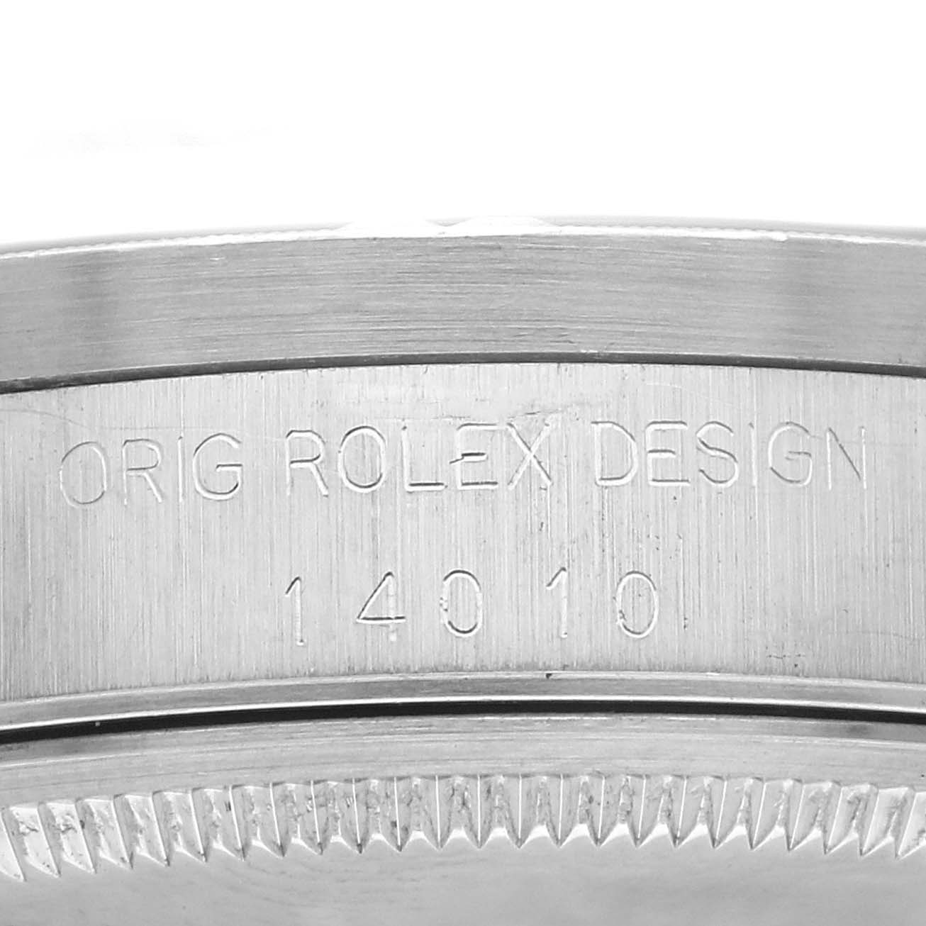 The image shows a close-up of the side of a Rolex Air-King watch, model number 14010, featuring engraved text on the metal surface.