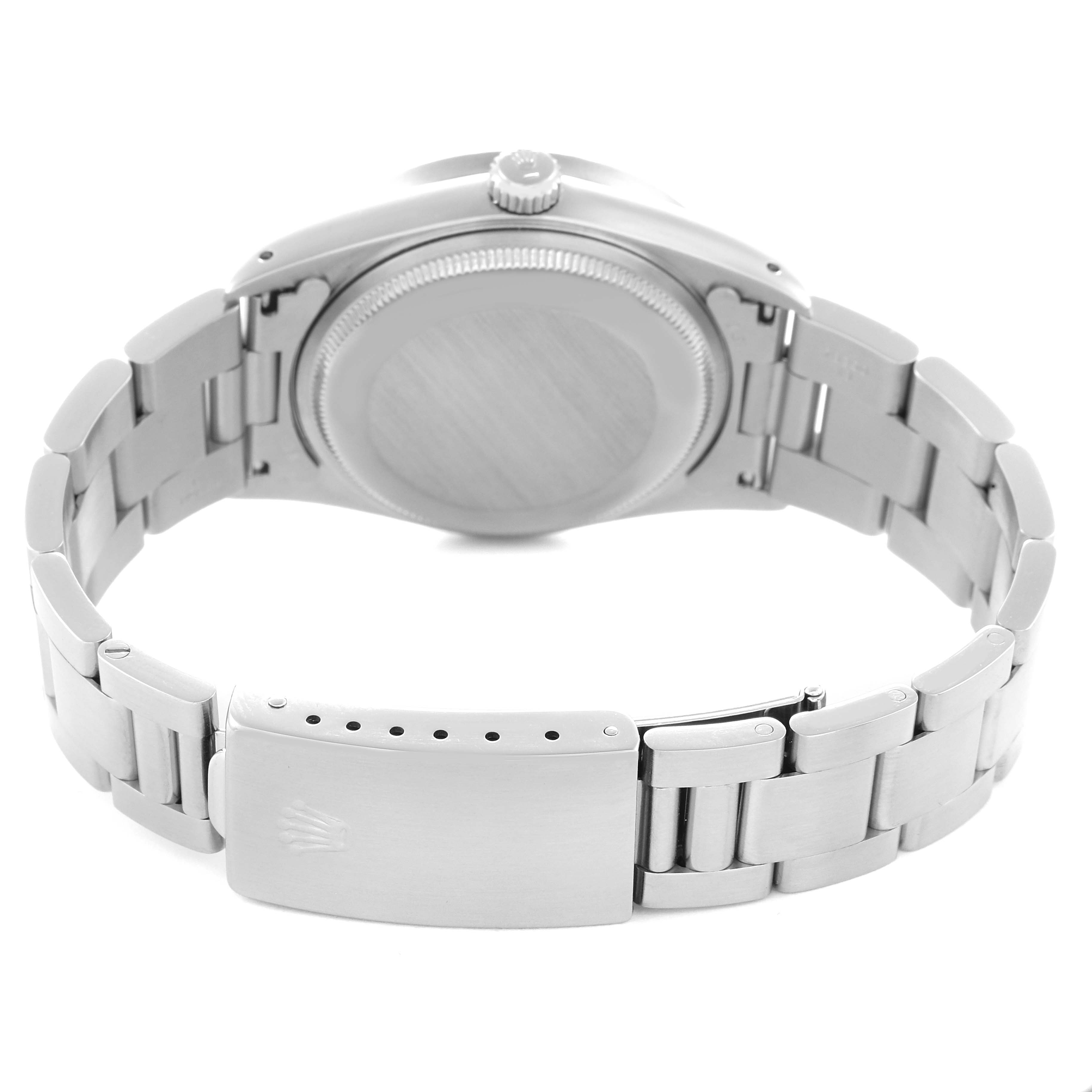 The image shows the back view of a Rolex Air-King model 14010 men's watch, highlighting the case back, bracelet, and clasp.