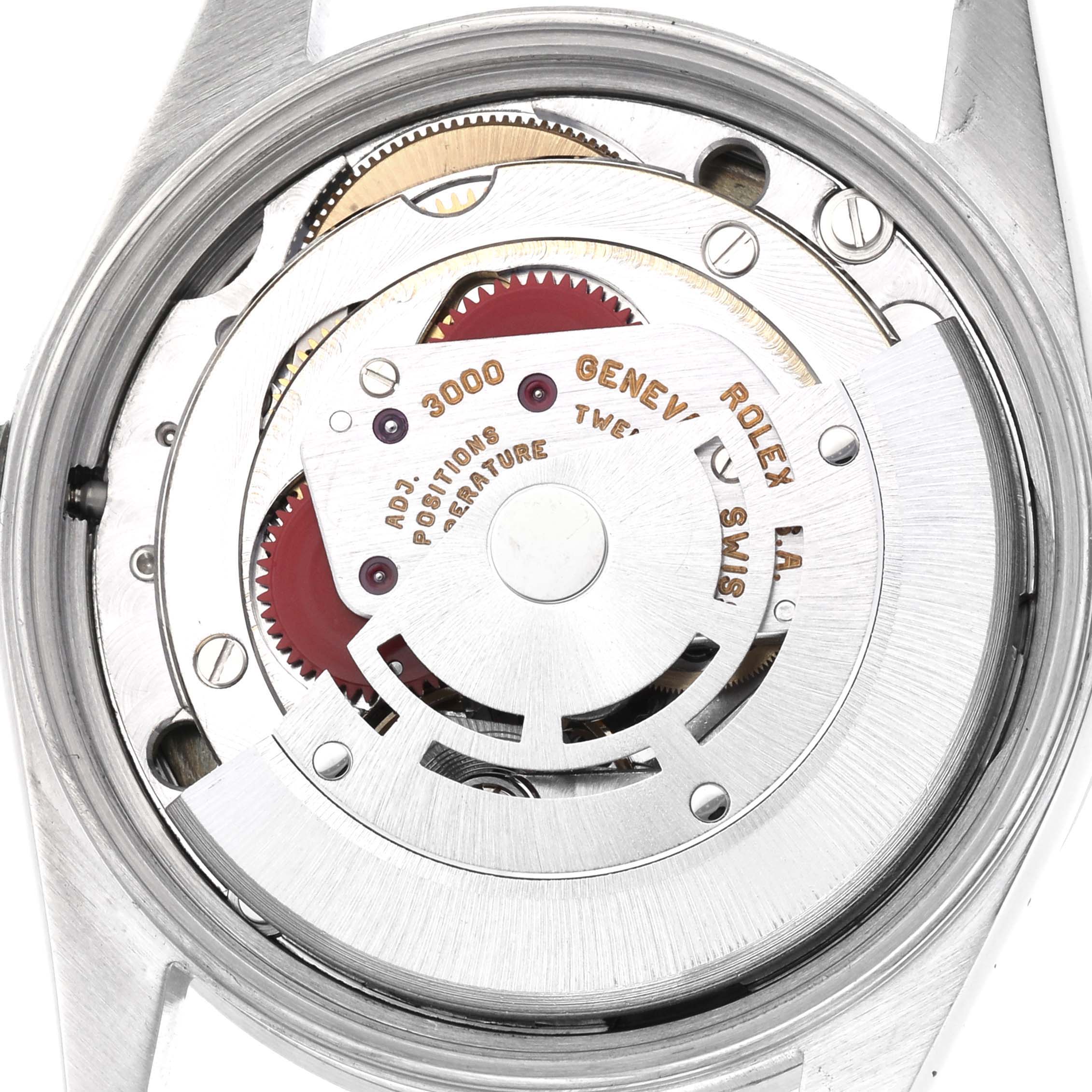 The image shows the inner movement of a Rolex Air-King watch, model number 14010, with visible gears and inscriptions.