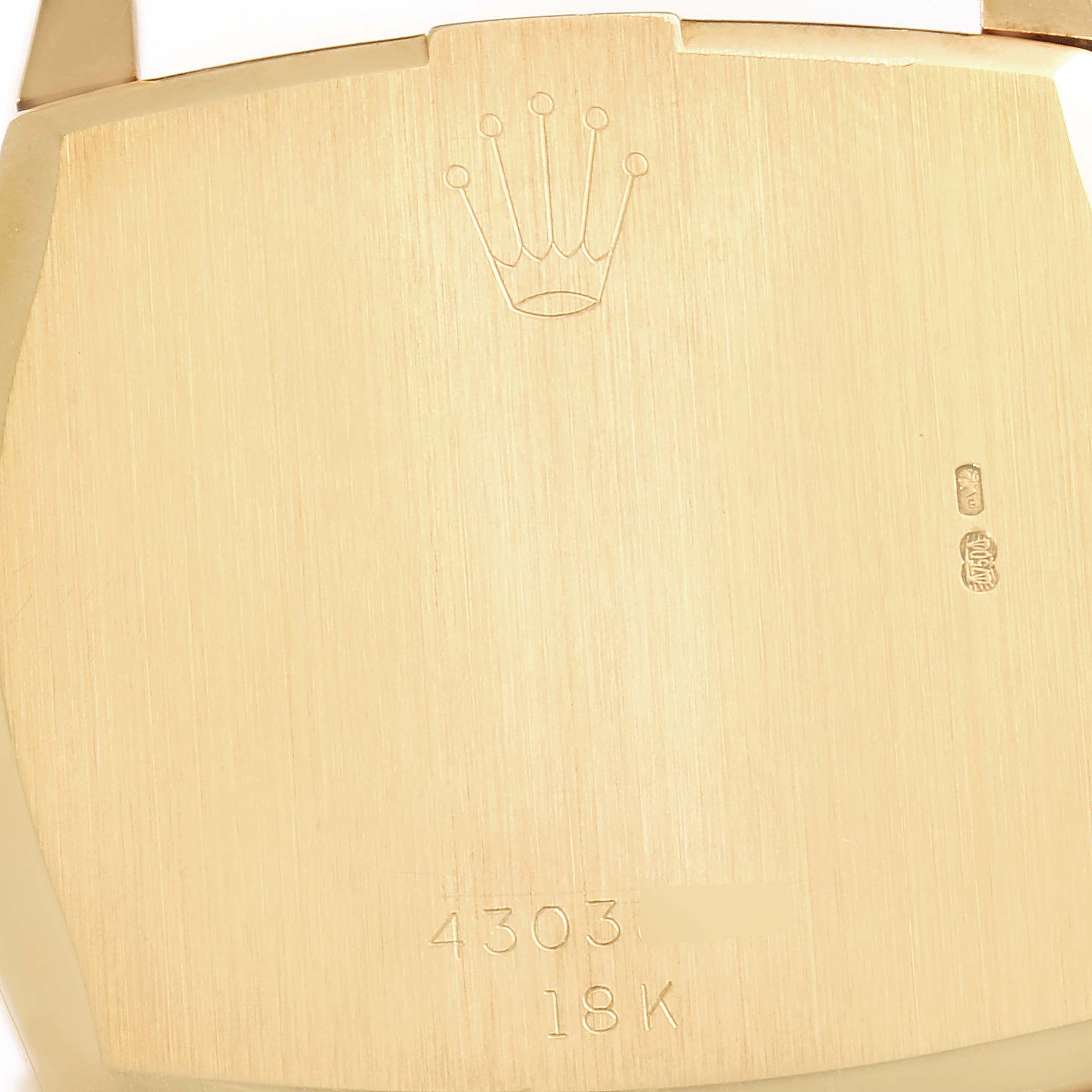 The image shows the back case of a Vintage Collection model by Rolex, featuring engravings and the 18K gold hallmark.