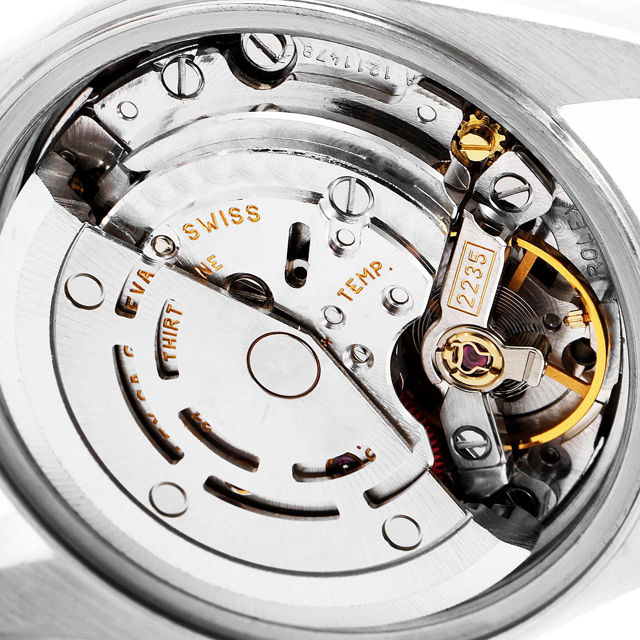 The image shows a close-up of the movement mechanism of a Rolex Datejust 79174 Women
s Stainless Steel Silver Dial 79174 Women
s Stainless Steel Silver Dial watch.