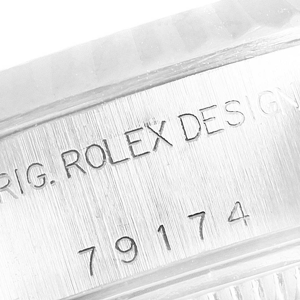 The image shows a close-up of the inscribed model number and branding on the side of a Rolex Datejust 79174 Women
s Stainless Steel Silver Dial 79174 Women
s Stainless Steel Silver Dial watch case.