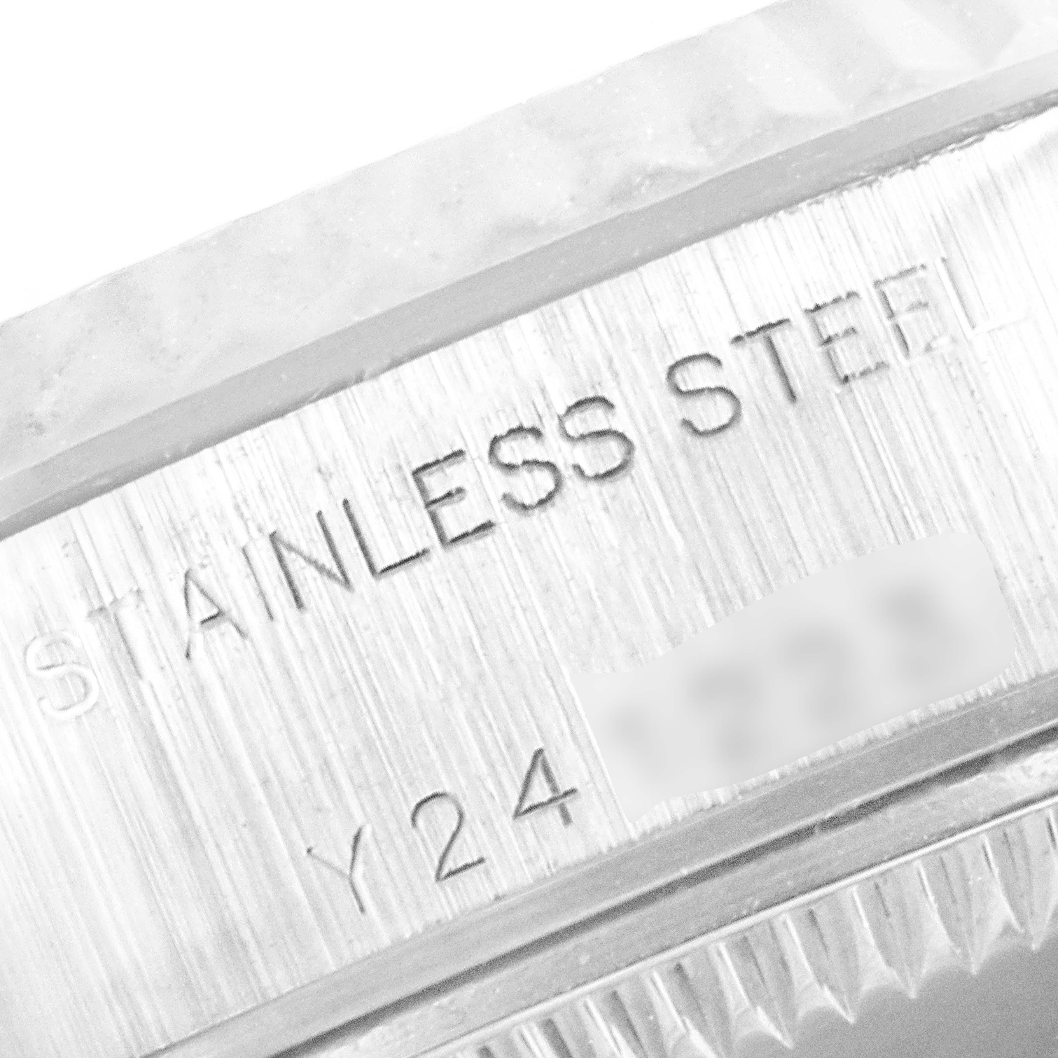The image shows a close-up of the bezel and case, focusing on the "STAINLESS STEEL" engraving of a Rolex Datejust 79174 Women
s Stainless Steel Silver Dial 79174 Women
s Stainless Steel Silver Dial watch.