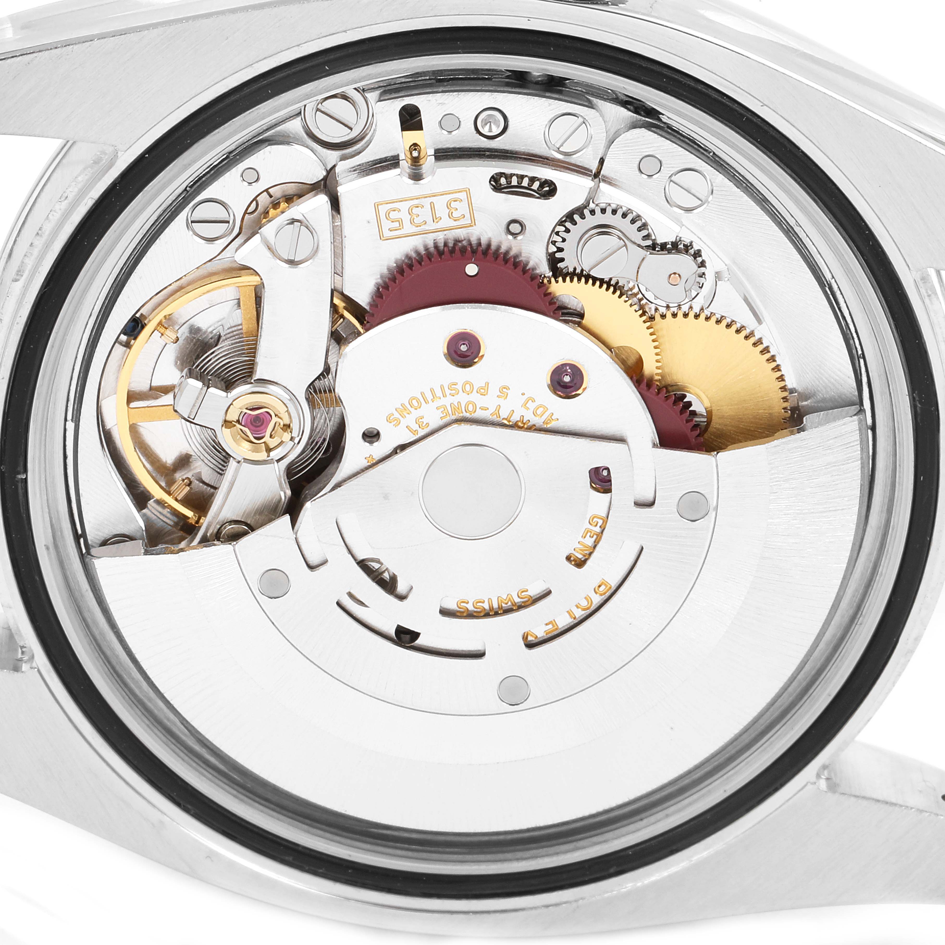 This is an internal view of the Rolex Datejust 116200 Men
s Stainless Steel Black Dial 116200 Men
s Stainless Steel Black Dial watch, showcasing its intricate movement and mechanical parts.