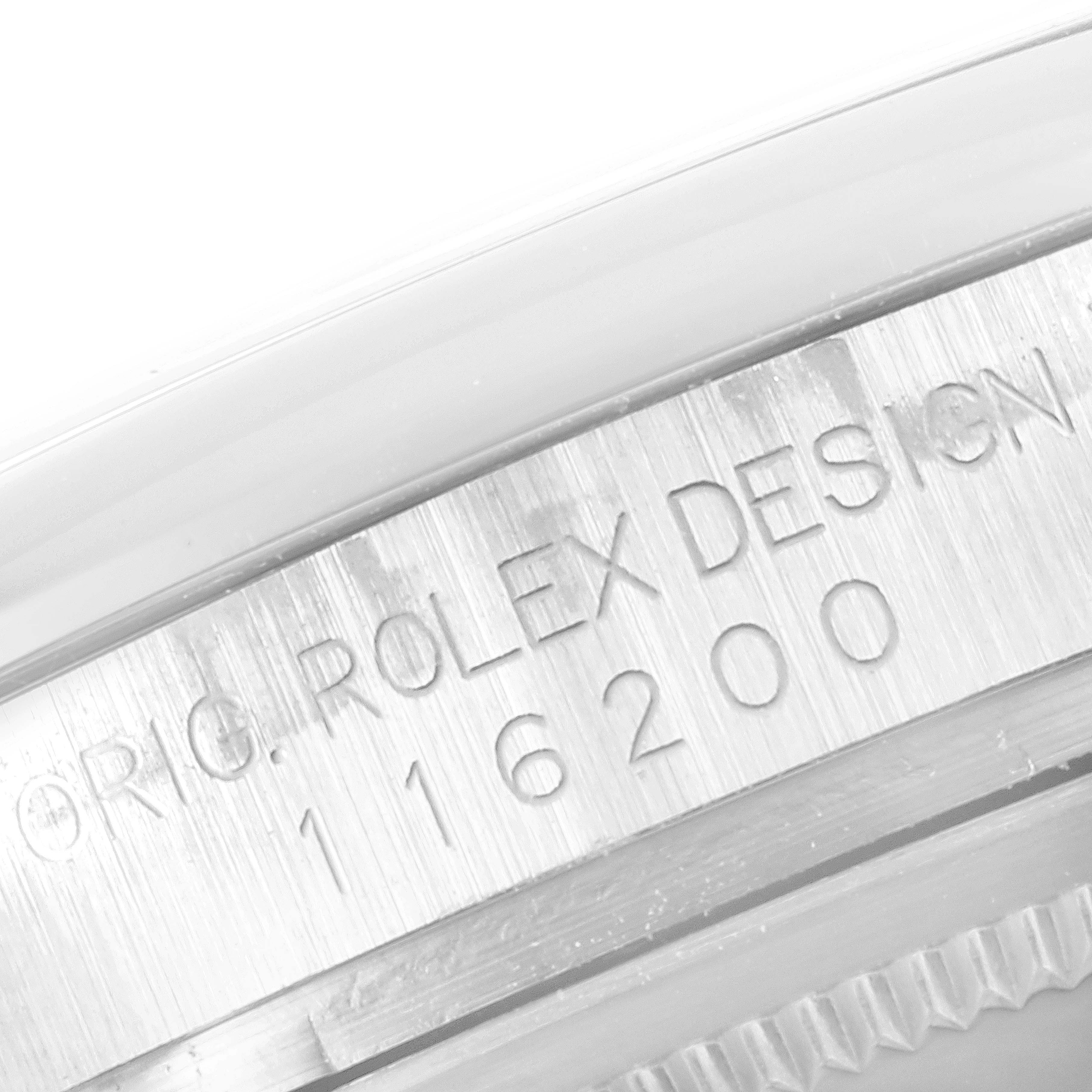 This image shows a close-up view of the model number "116200" engraved on the side of a Rolex Datejust 116200 Men
s Stainless Steel Black Dial 116200 Men
s Stainless Steel Black Dial watch.