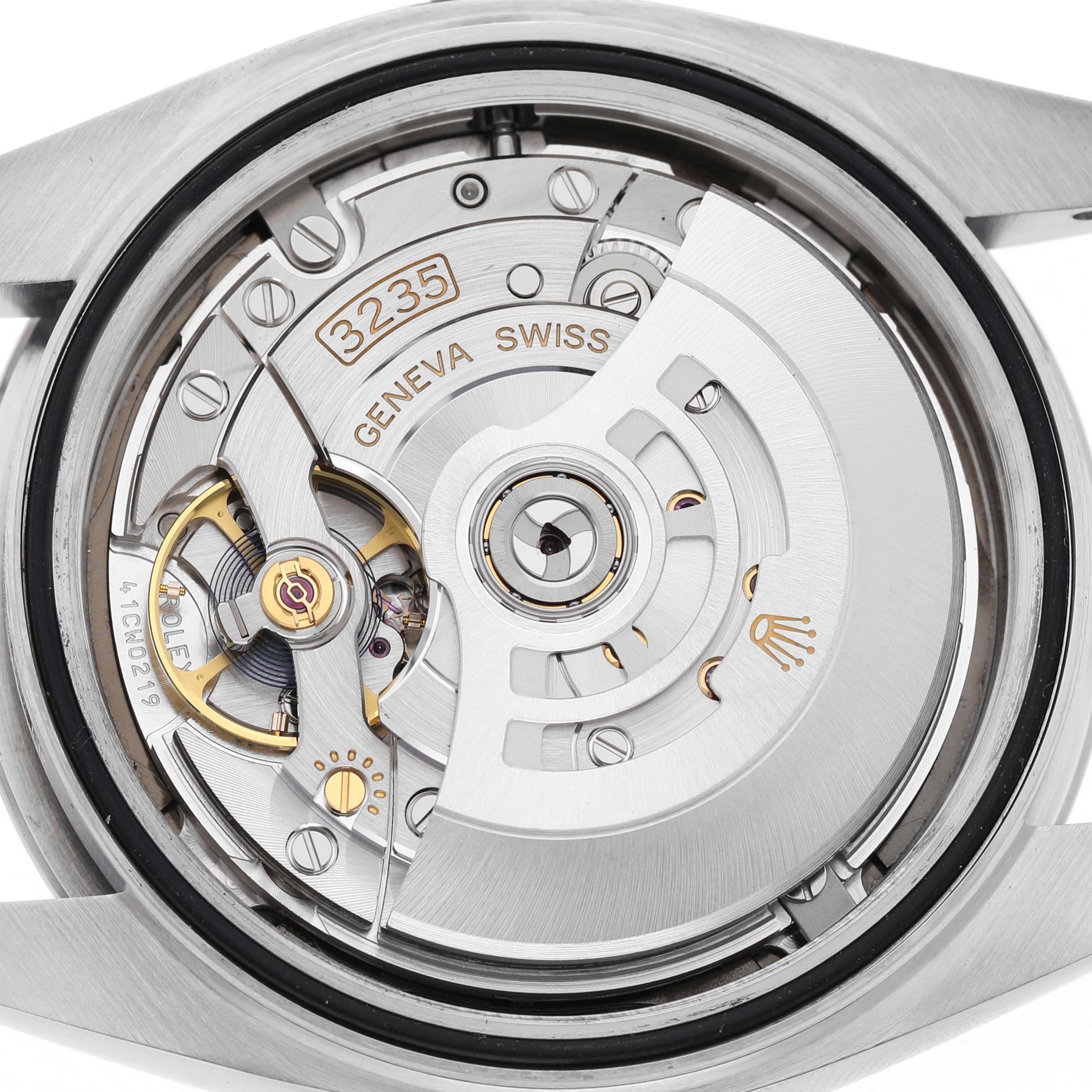 The image shows the movement of a Rolex Datejust 41 126300 Men's Stainless Steel Grey Dial, focusing on the intricate details of the caliber 3235.