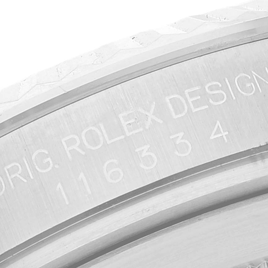This image shows a close-up of the engraved bezel on a Rolex Datejust 41 116334 Men's Stainless Steel Silver Dial 116334 Men's Stainless Steel Silver Dial watch.