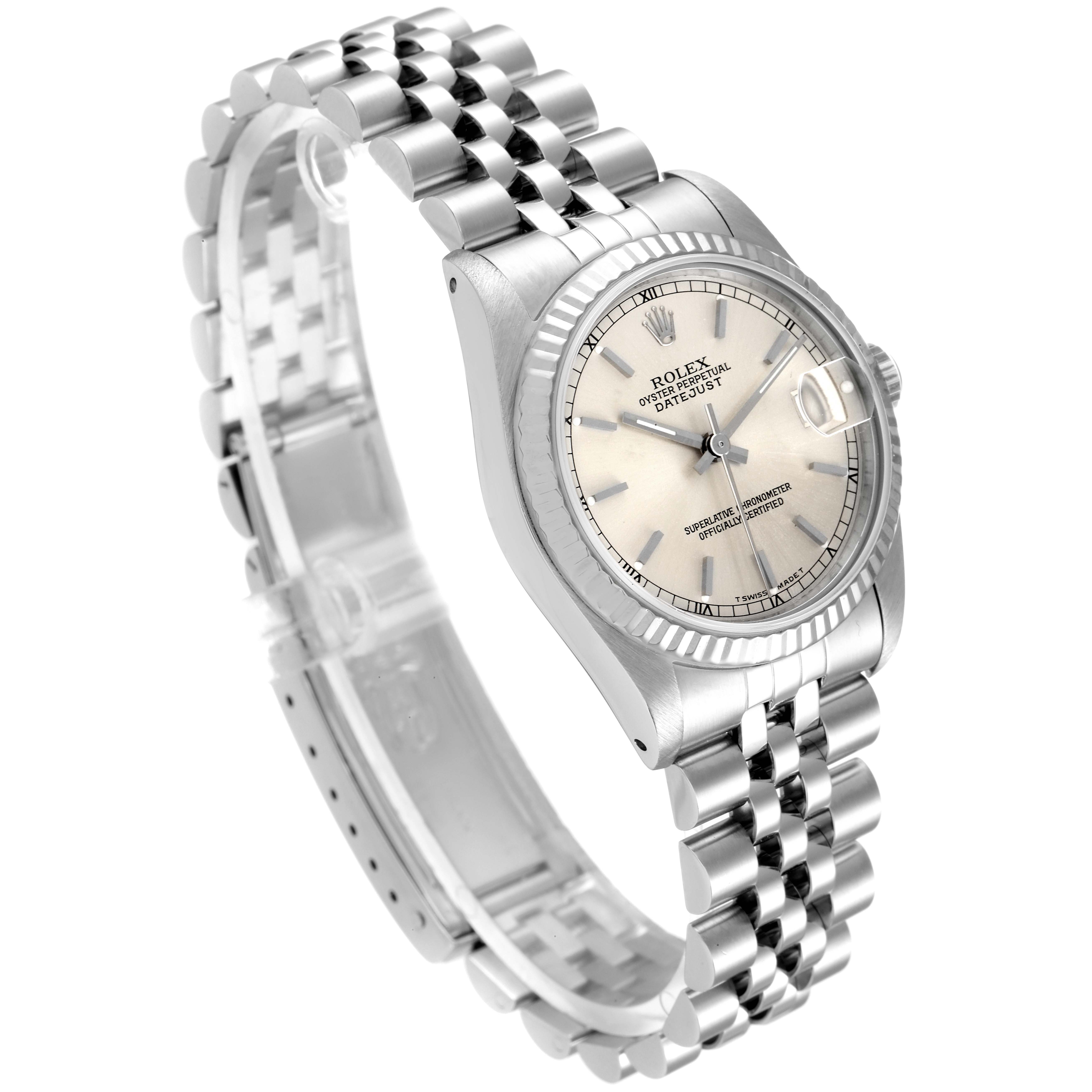 This image shows a side-angle view of a Rolex Mid-Size 68274 Women's Stainless Steel Silver Dial 68274 Women's Stainless Steel Silver Dial Datejust watch, highlighting the watch face and stainless steel bracelet.