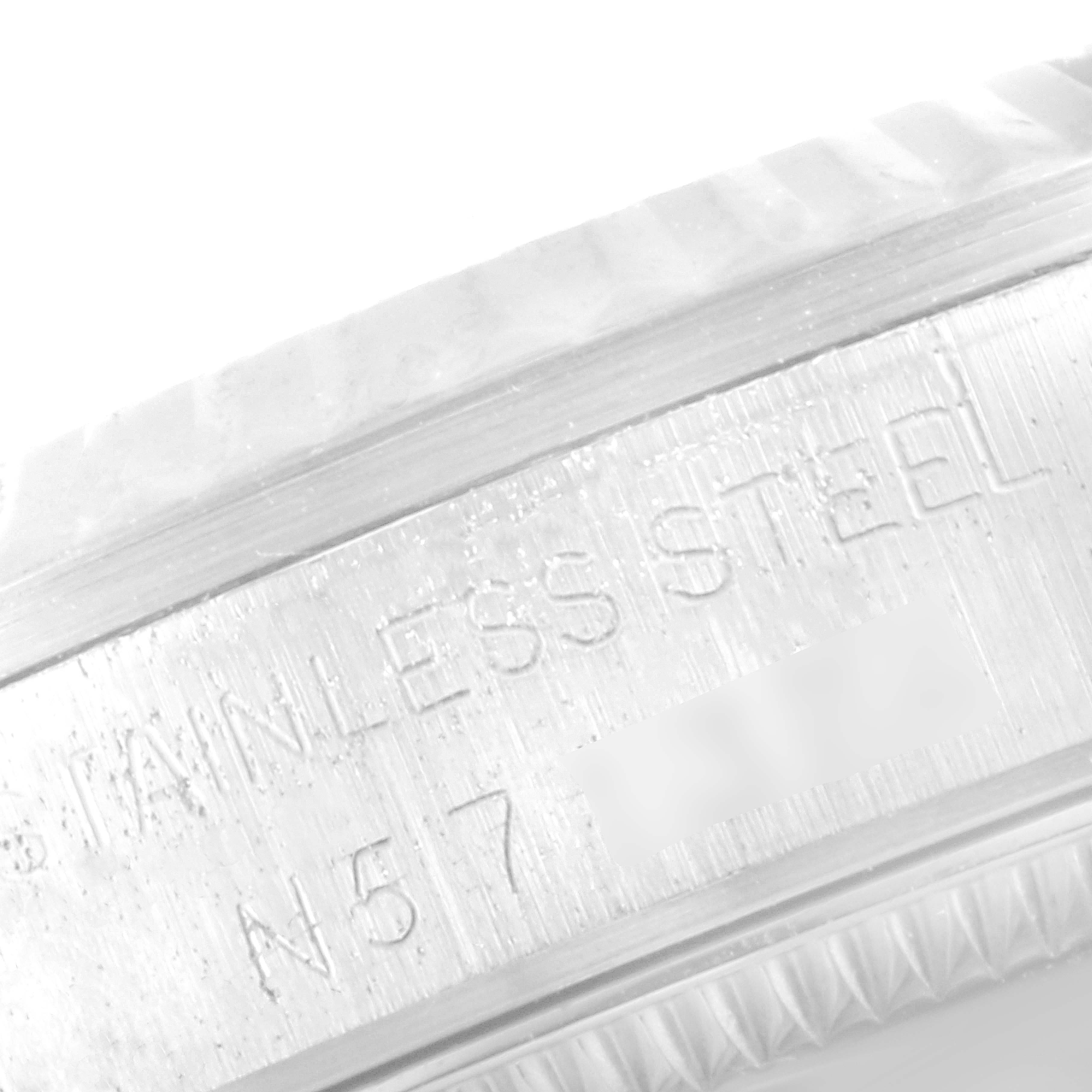This image shows a close-up of the stainless steel engraving on the side of a Rolex Mid-Size 68274 Women's Stainless Steel Silver Dial 68274 Women's Stainless Steel Silver Dial watch case.