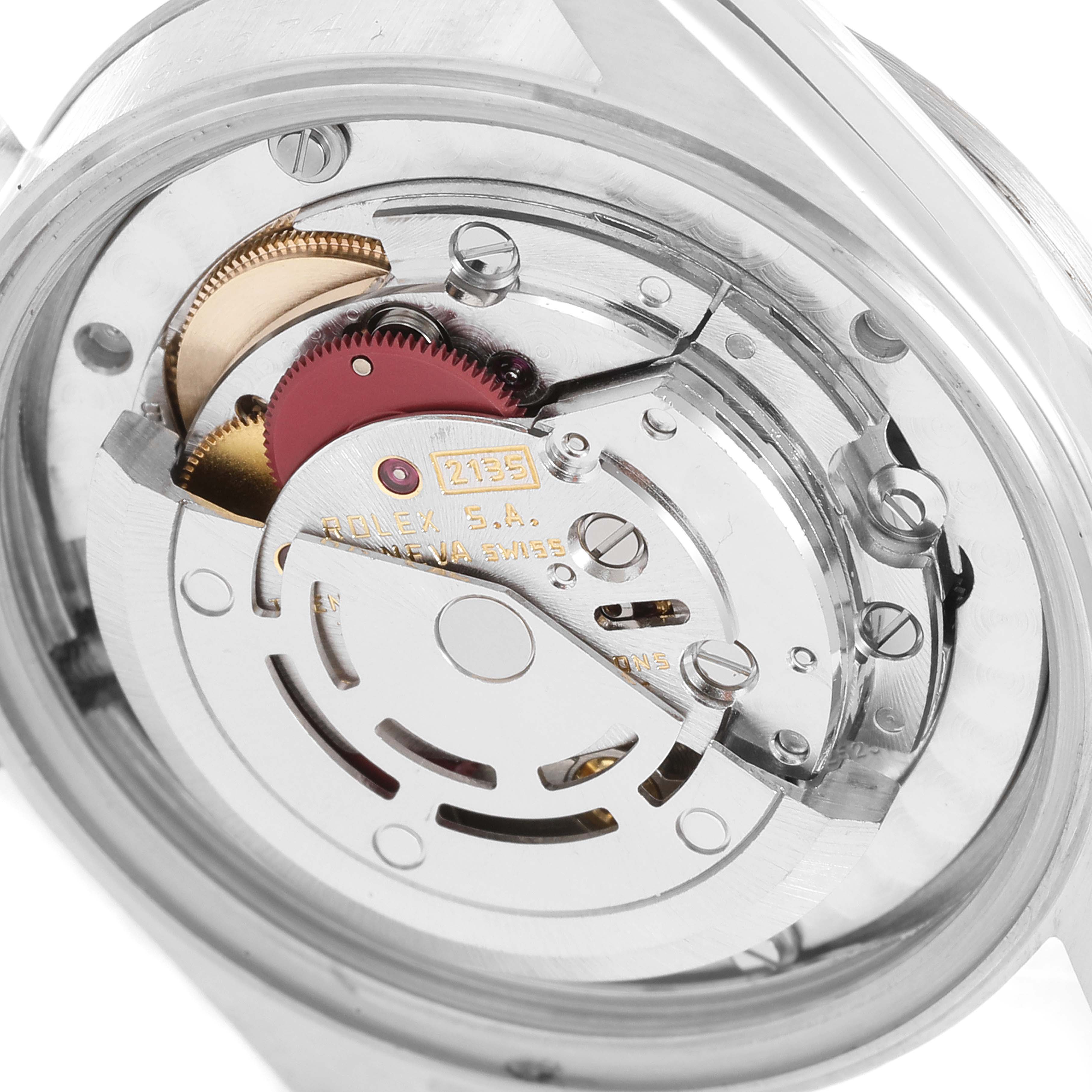 This image shows the movement mechanism of a Mid-Size Rolex watch from a back or internal angle.