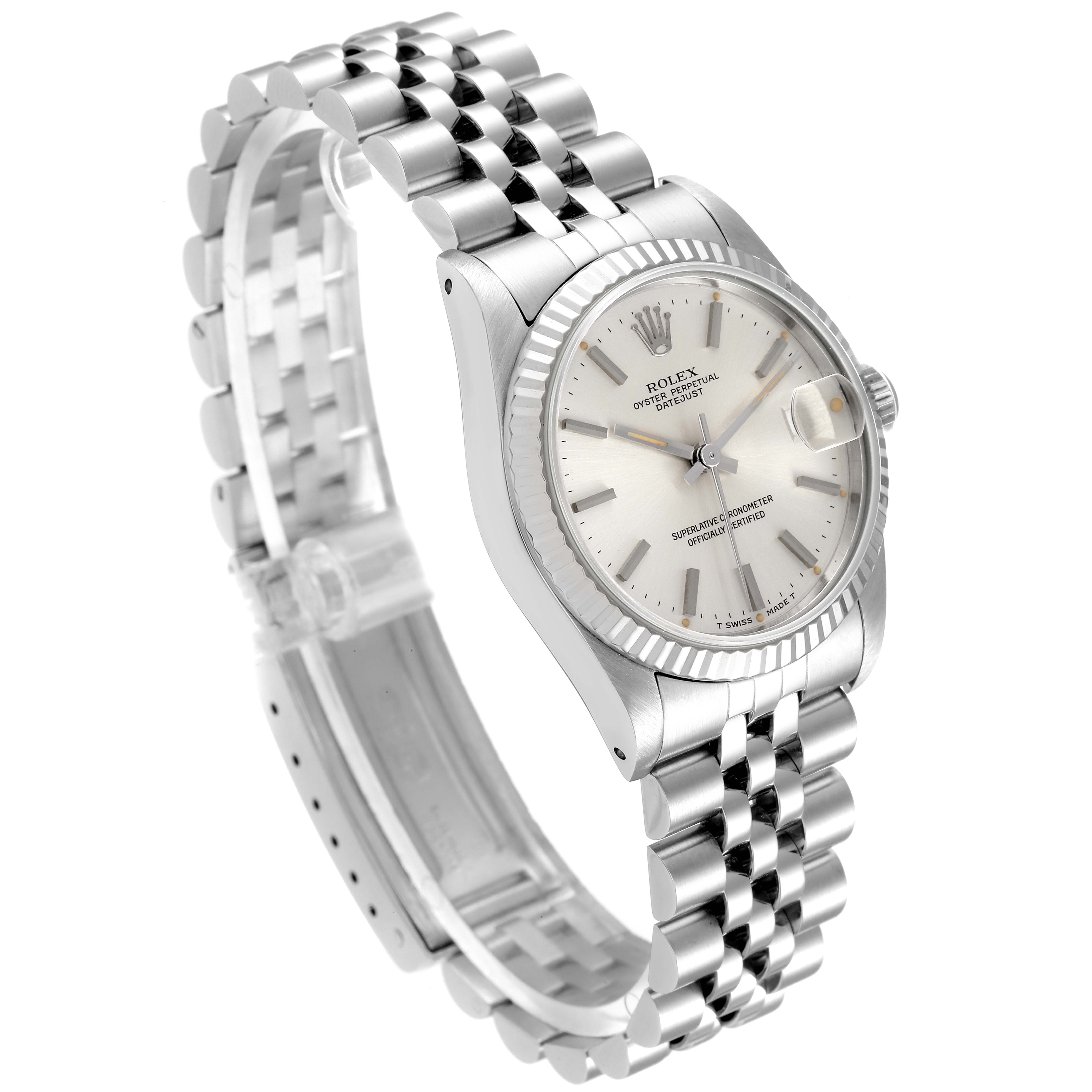 The image shows a Rolex Mid-Size 68274 Women
s Stainless Steel Silver Dial 68274 Women
s Stainless Steel Silver Dial model watch at an angled view, highlighting the face, bezel, and metal bracelet.