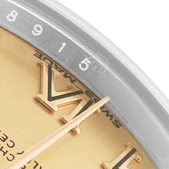 The image shows a close-up of the Rolex Mid-Size 178273 Women's Steel and Gold (two tone) Champagne Dial watch dial, highlighting Roman numerals, hands, and part of the outer bezel.