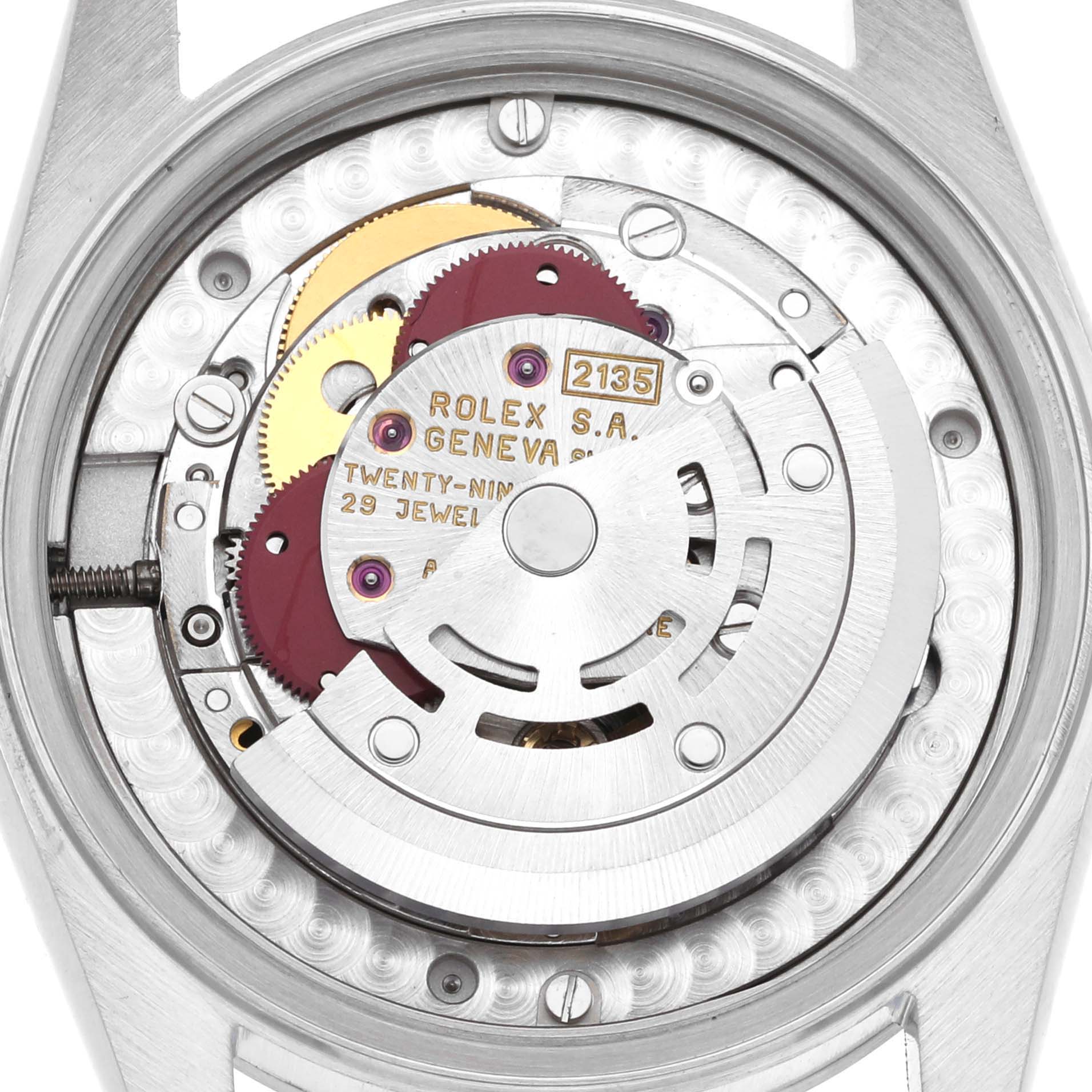 This image shows the internal mechanical movement of a Mid-Size Rolex watch, focusing on its intricate gears and components.