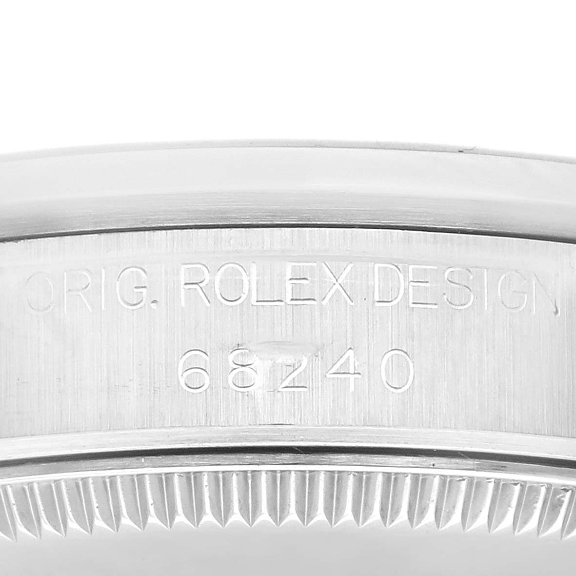 This is a close-up angle of a Rolex Mid-Size 68240 Women's Stainless Steel Silver Dial 68240 Women's Stainless Steel Silver Dial watch showing the engraved design and model number (68240) on the case.