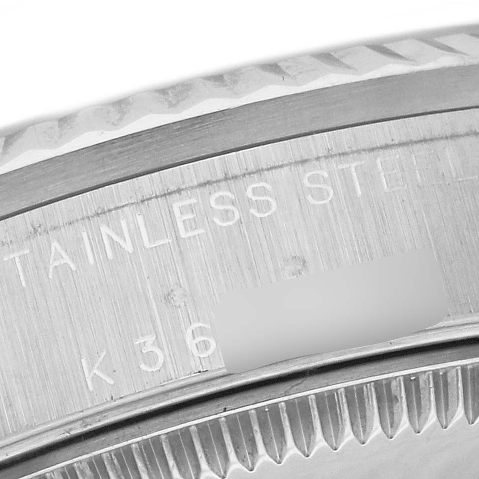 The image shows a close-up of the stainless steel bezel and serial number of a Rolex Mid-Size 78274 Women's Stainless Steel Silver Dial 78274 Women's Stainless Steel Silver Dial model watch.