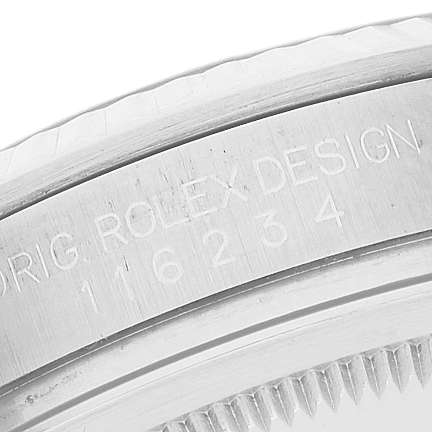 This close-up image shows the engraving and part of the bezel of a Rolex Datejust 116234 Men's Stainless Steel Black Dial 116234 Men's Stainless Steel Black Dial watch.